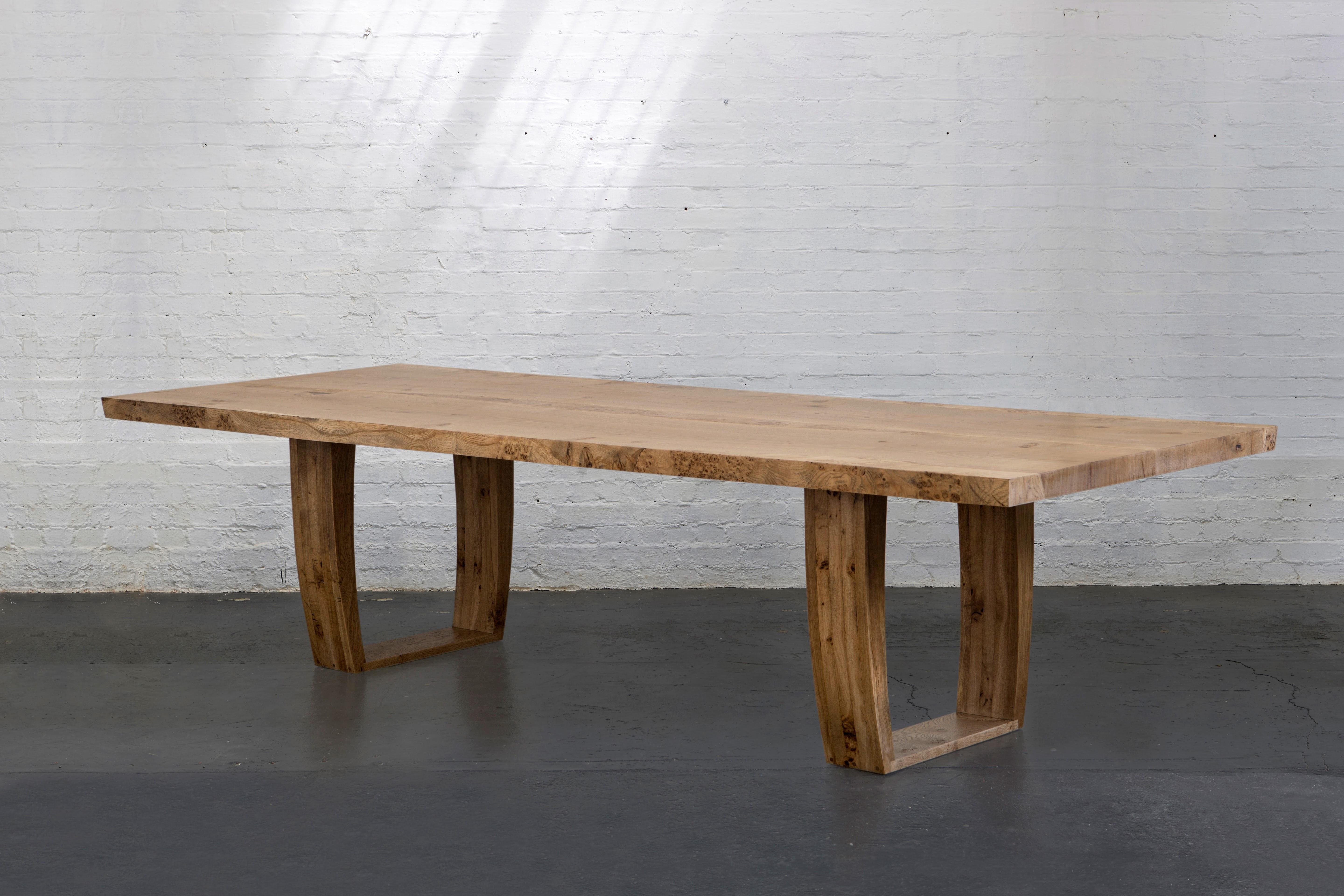 English oak table with handshake jointed tabletop, made from two pieces of oak with central infill of burr oak on monumental trapeze legs.

This is a custom made piece and can be made in different sizes and timbers. also with natural, bleached and