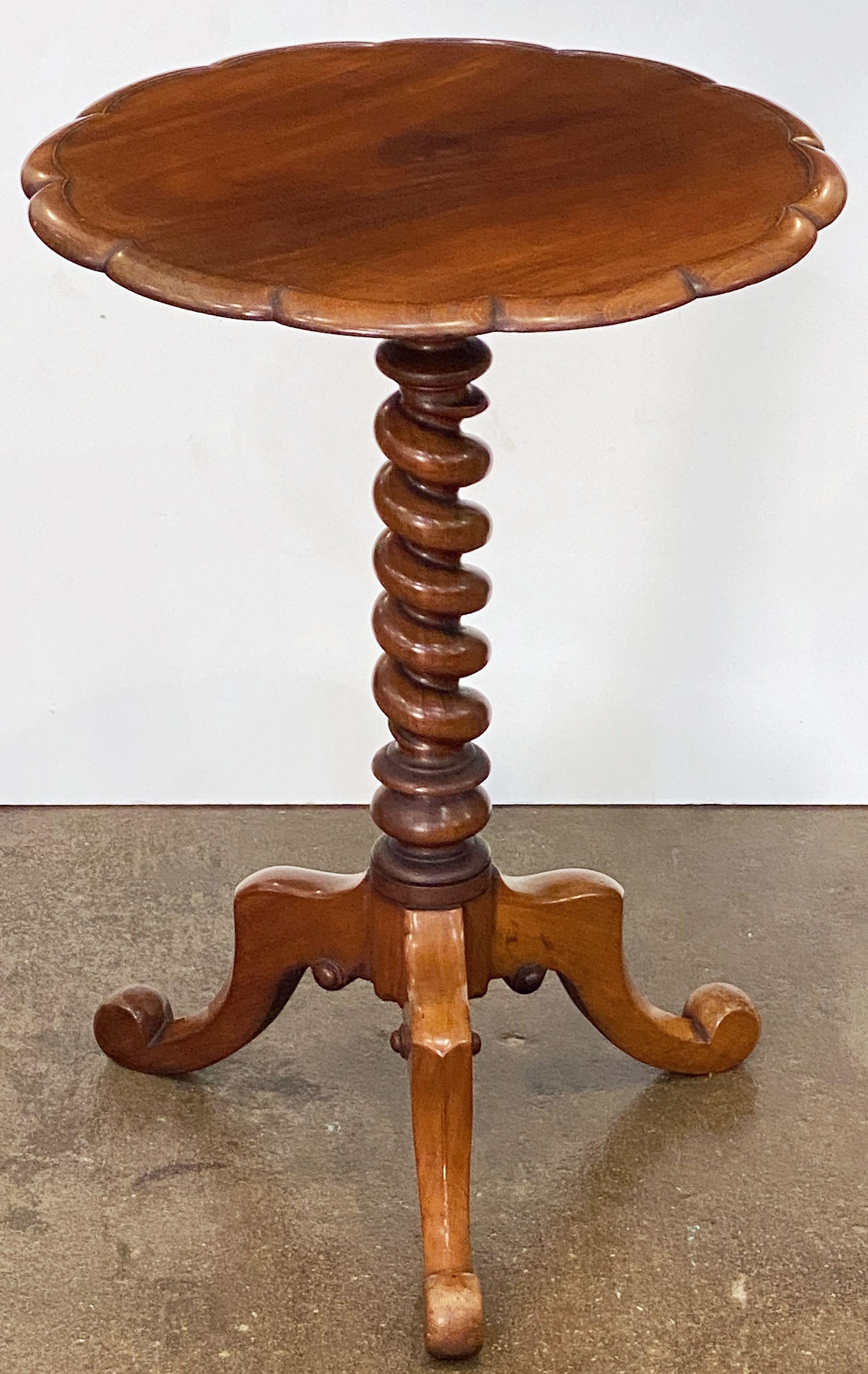 A handsome English occasional wine or drinks table of mahogany, featuring a round or circular scalloped-edge top over a finely-turned barley twist stem or column with tripod legs.

Makes a great occasional or side table for a chair or sofa.