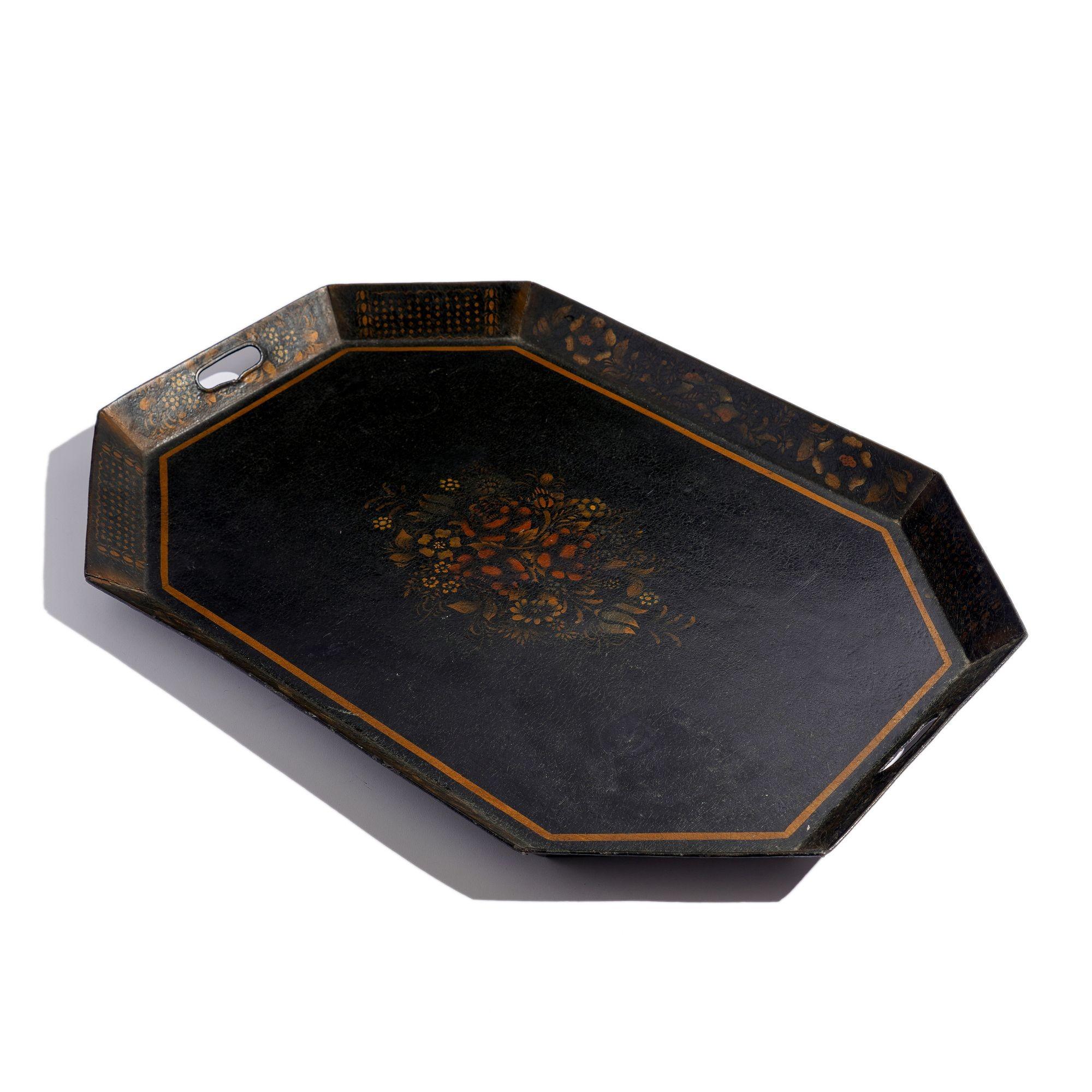 Octagonal canted standing rim tole tray with stenciled floral decorated interior & border. The rim is pierced with handle grips.
England, circa 1815.
Condition: Craquelure to the tray surface and fading to the painted surface decorations but in good