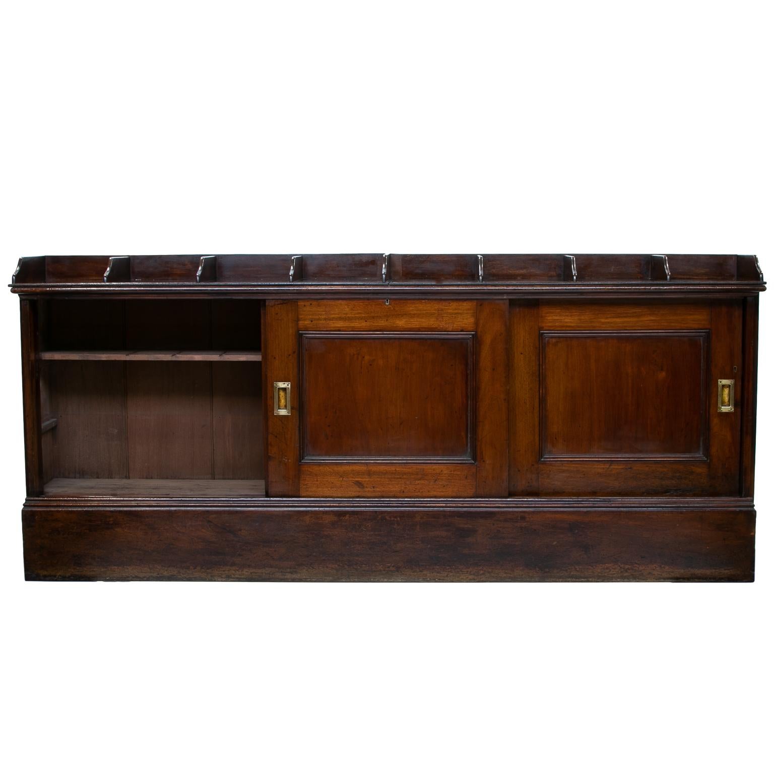 English office cabinet or shops cabinet
A fantastic Edwardian era office cabinet or called shops cabinets. The top divided into eight sections. Filing or shirts. Great cabinet for a clothing store. Below are the sliding doors revealing a cupboard
