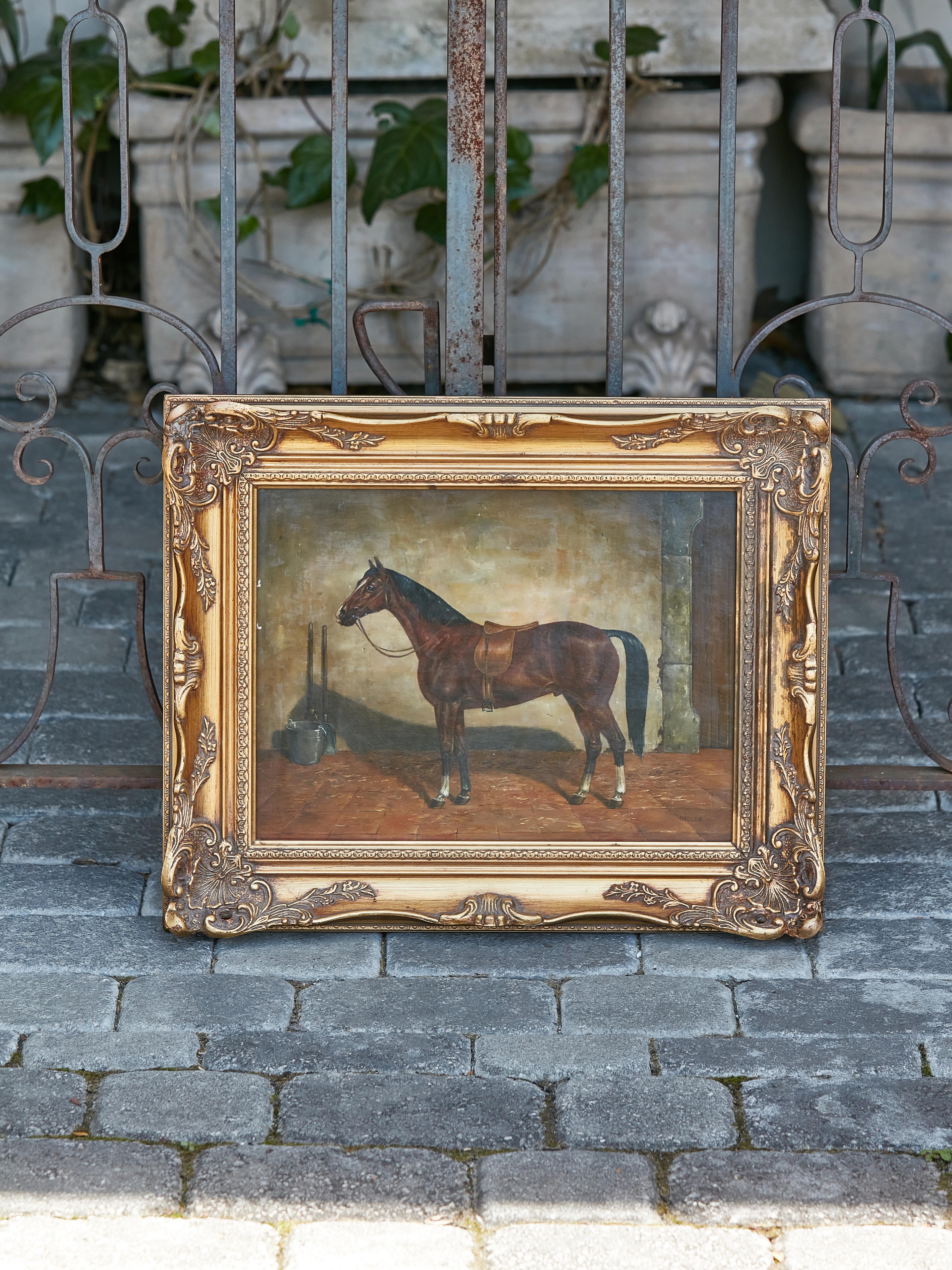 An English oil on board horse painting from the 20th century by K.M Nadler, in carved giltwood frame. Immerse yourself in a captivating depiction of equine grace with this mesmerizing 20th-century oil on board horse painting by the artist K.M.