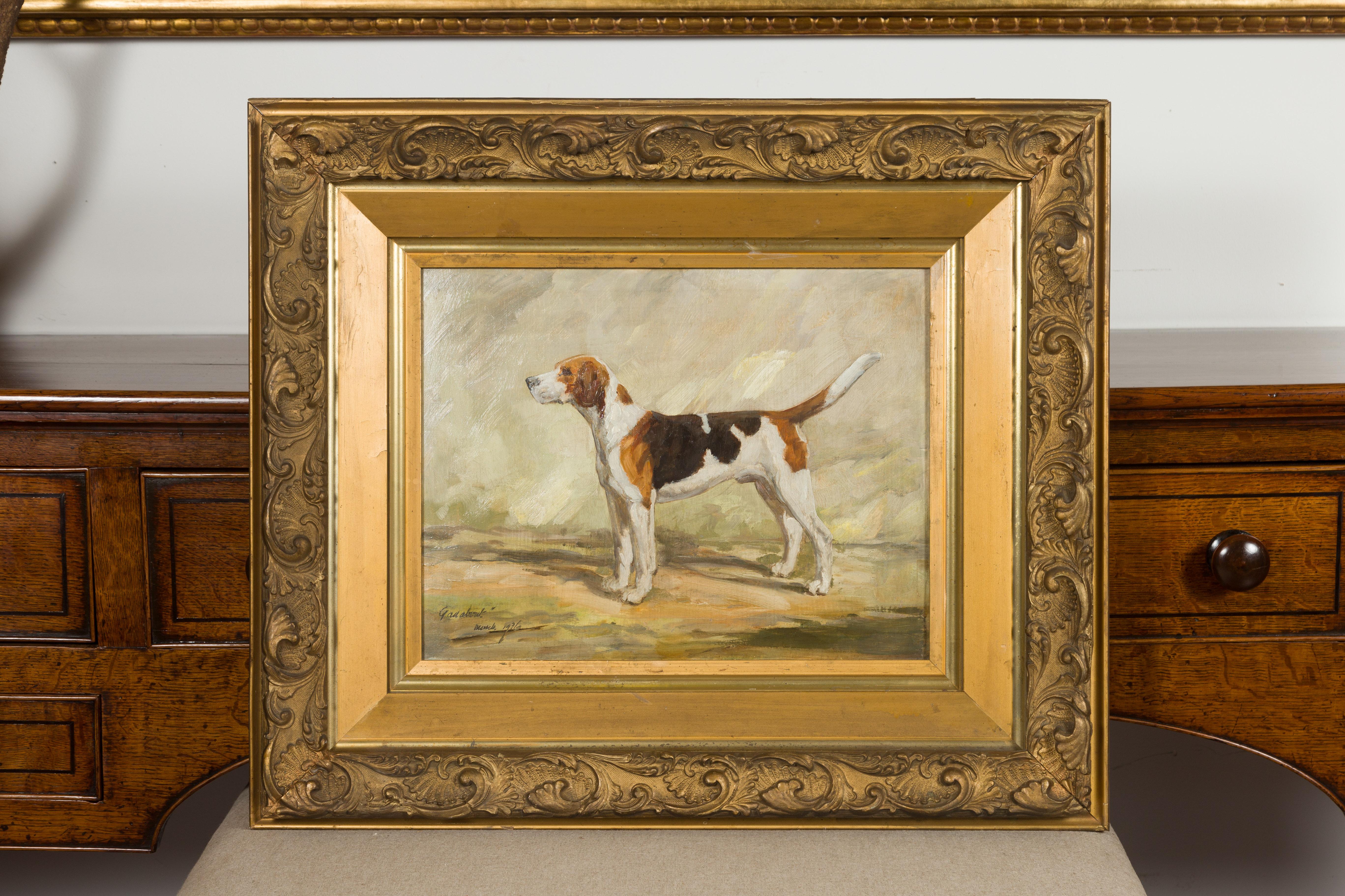 An English oil on board dog painting from the mid-20th century, depicting a hound in a landscape. Titled 