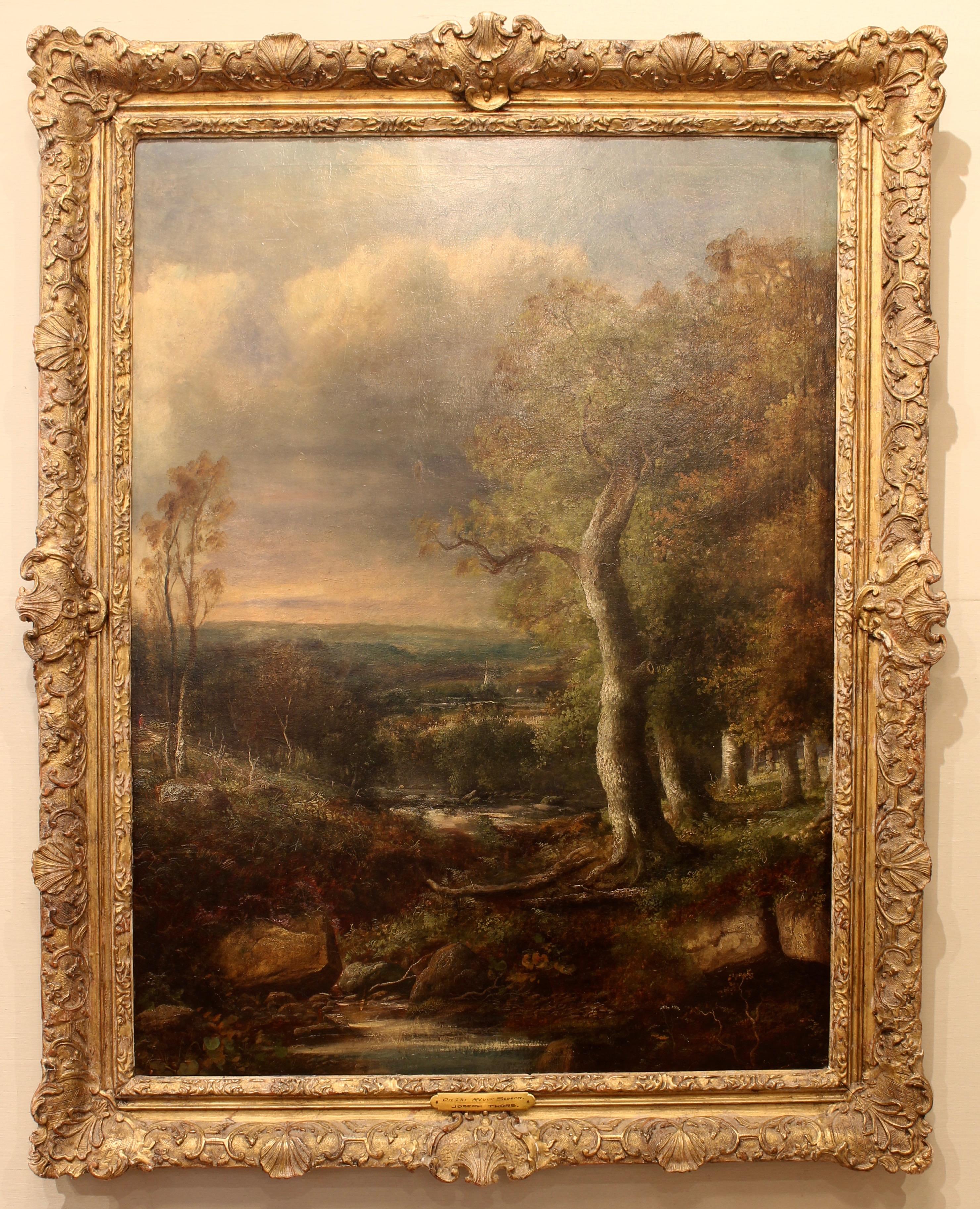 A large mid-19th century English oil on canvas landscape painting by Joseph Thors (1835-1920) a Dutch born English landscape painter known for his pastoral paintings of the English countryside. The painting appears to be in its original giltwood