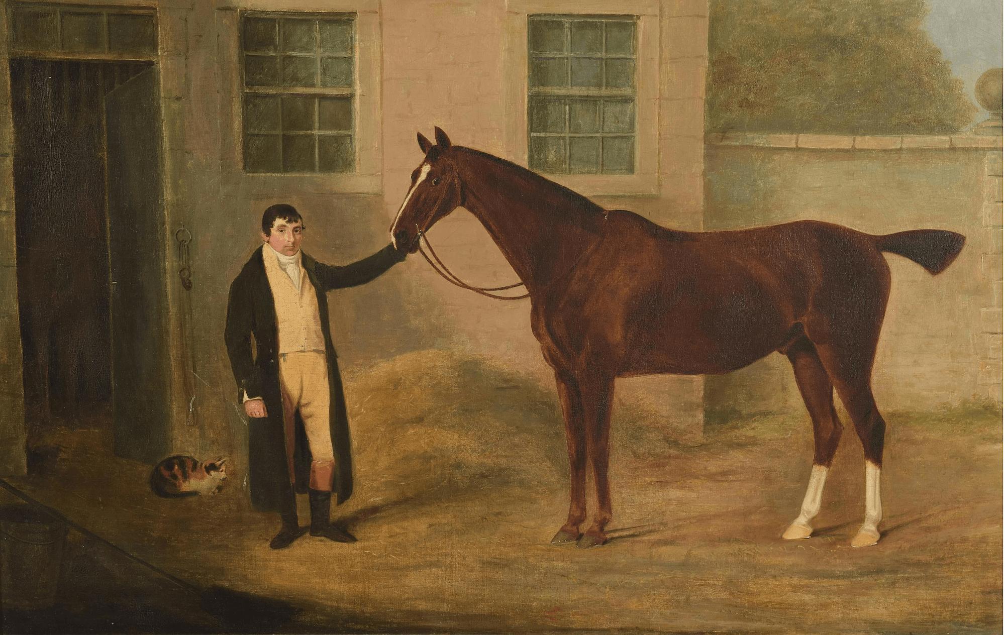 A stunning circa 1805 English equestrian oil on canvas painting firmly attributed to prominent late-Georgian period artist Benjamin Marshall portraying a dark bay thoroughbred horse with groom and calico cat outside architectural stable block