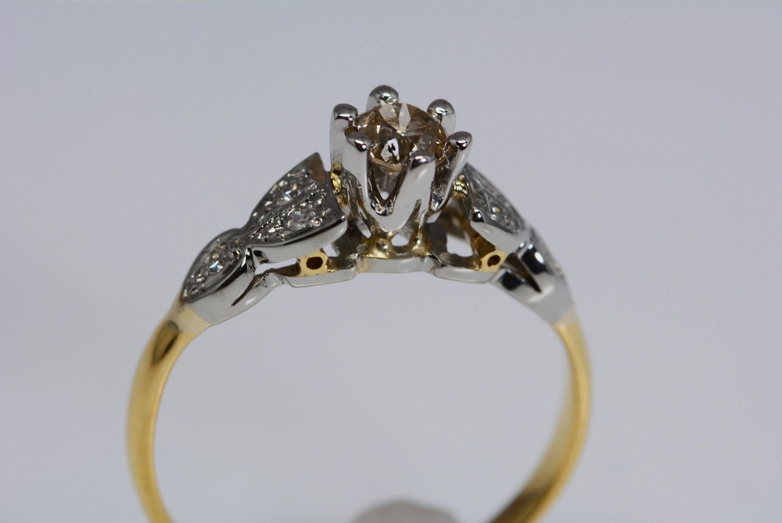 
This ring is from the early 20th century and it is of english origin. It is fabricated from 18 karat yellow gold and platinum. 
The ring band has 6 single cut diamonds in total, weighing: 0.06 carat total weight; 
In the center is 1 old european