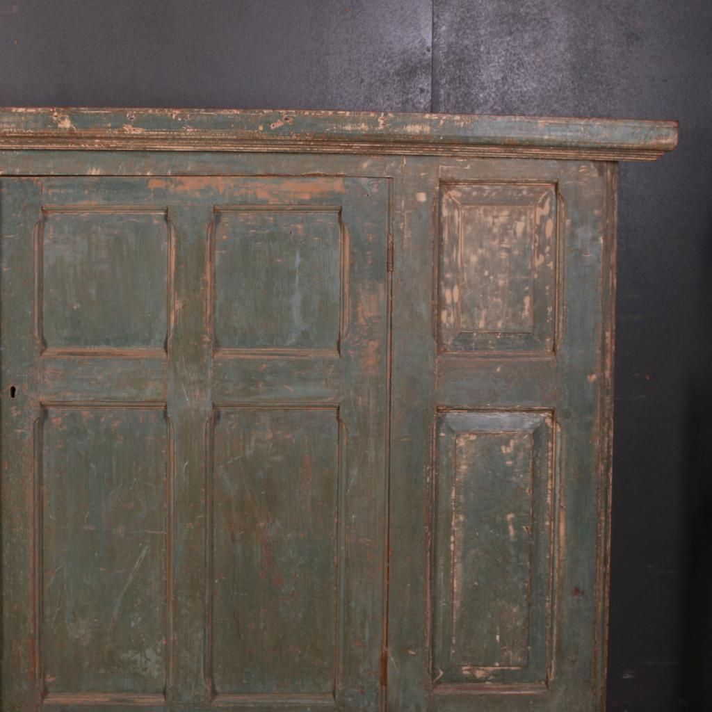 Wonderful 18th century original painted low housekeepers cupboard, 1780.

Dimensions
94.5 inches (240 cms) wide
18 inches (46 cms) deep
50.5 inches (128 cms) high.