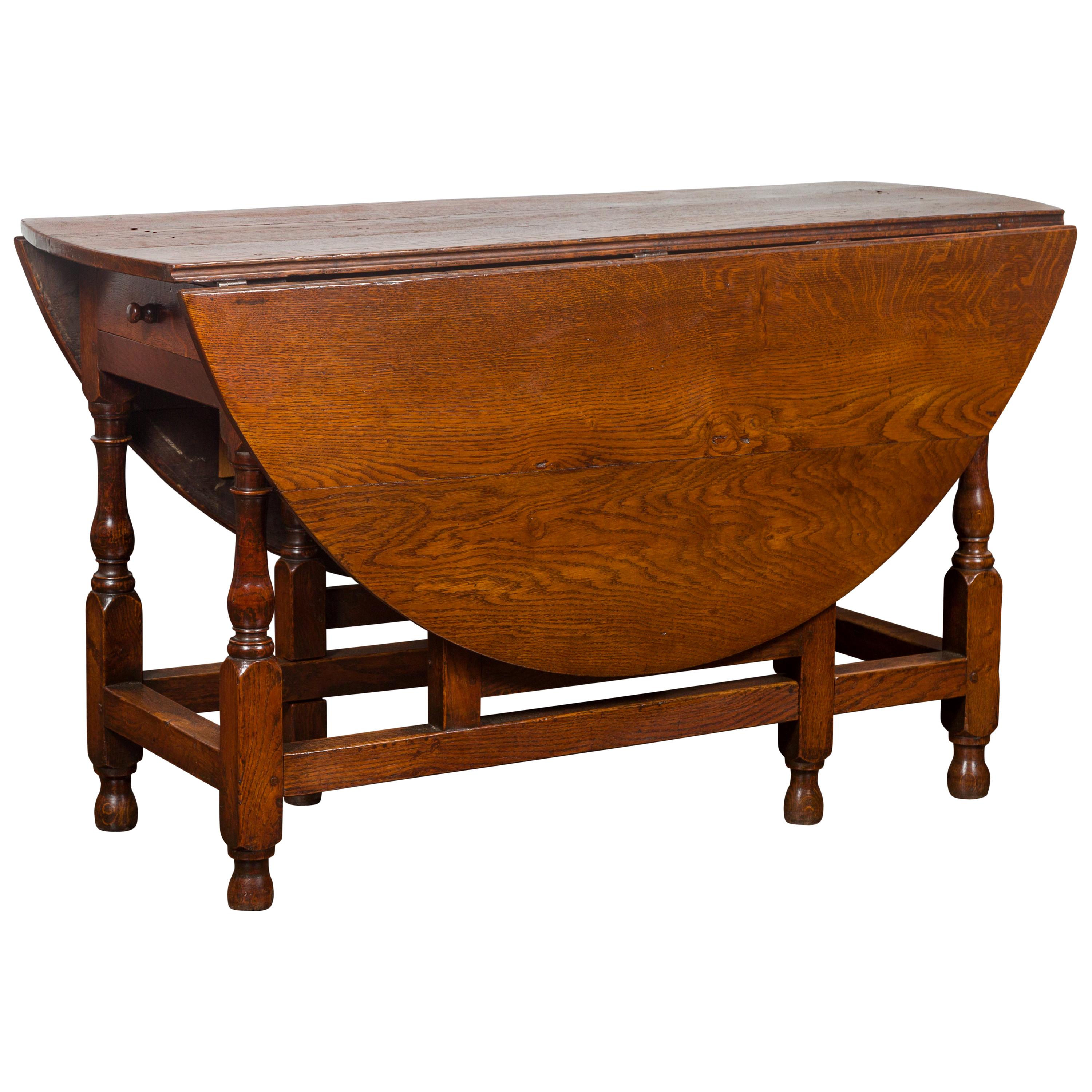 English Oval Oak Drop-Leaf Table with Single Drawer and Baluster Legs