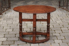 English Oval Oak Side Table with Turned Base and Cross Stretcher, circa 1860