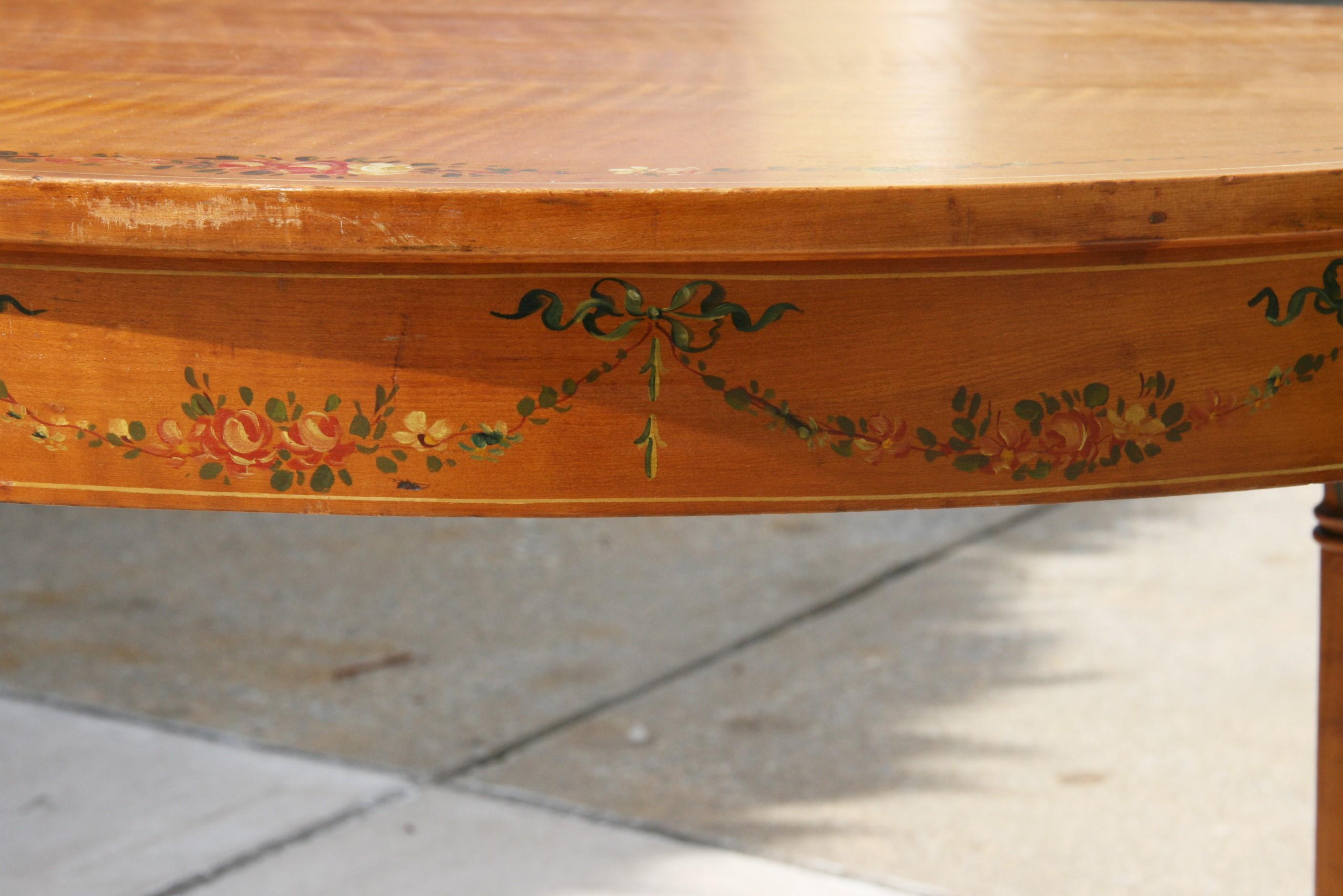 3-466 English oval tiger maple library table/desk  with hand painted details.
Ideal size to be used as laptop desk