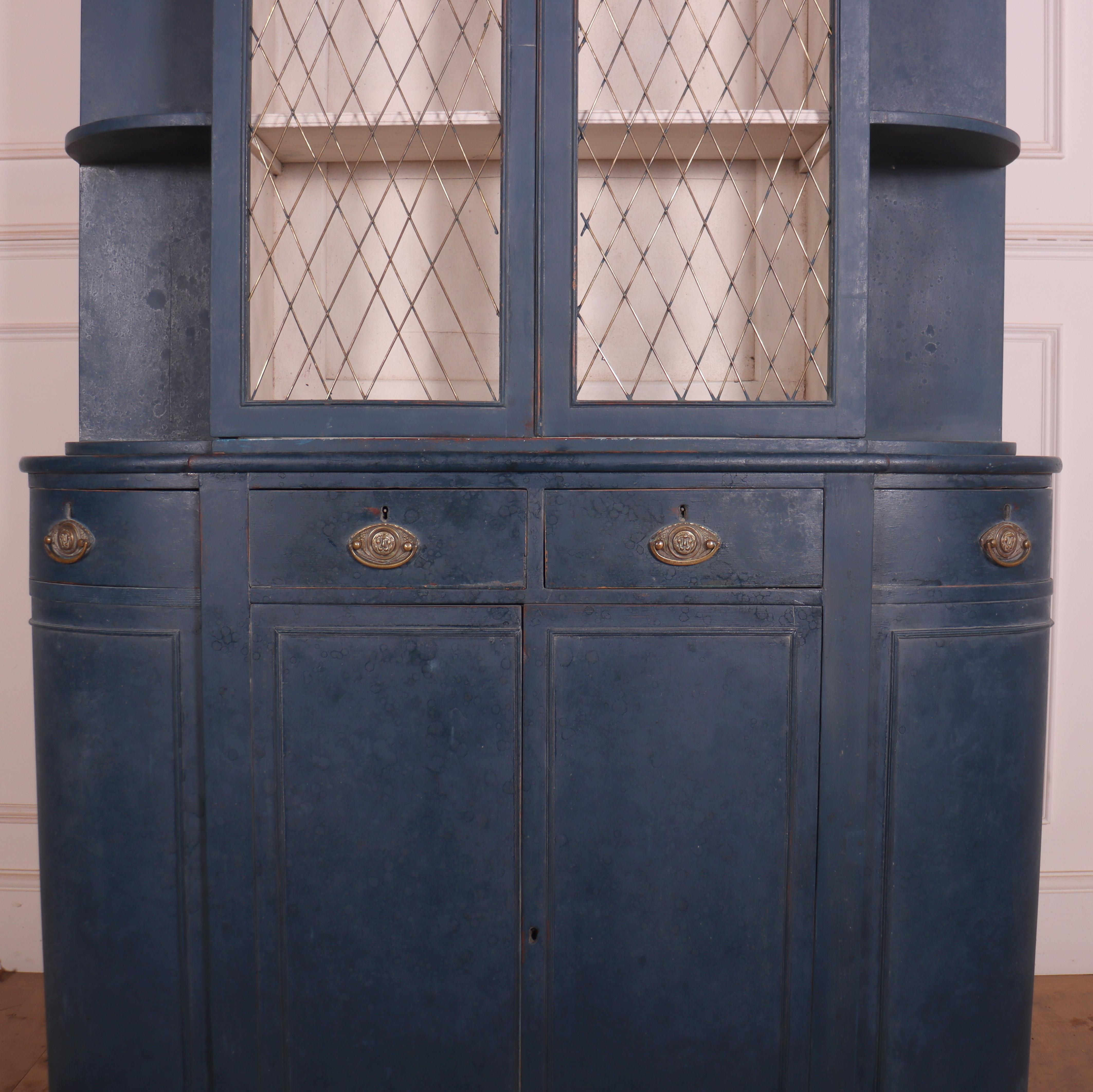 Very small English Regency period painted oak bookcase with brass grill doors. 1820.

Internal shelf depth is 7
