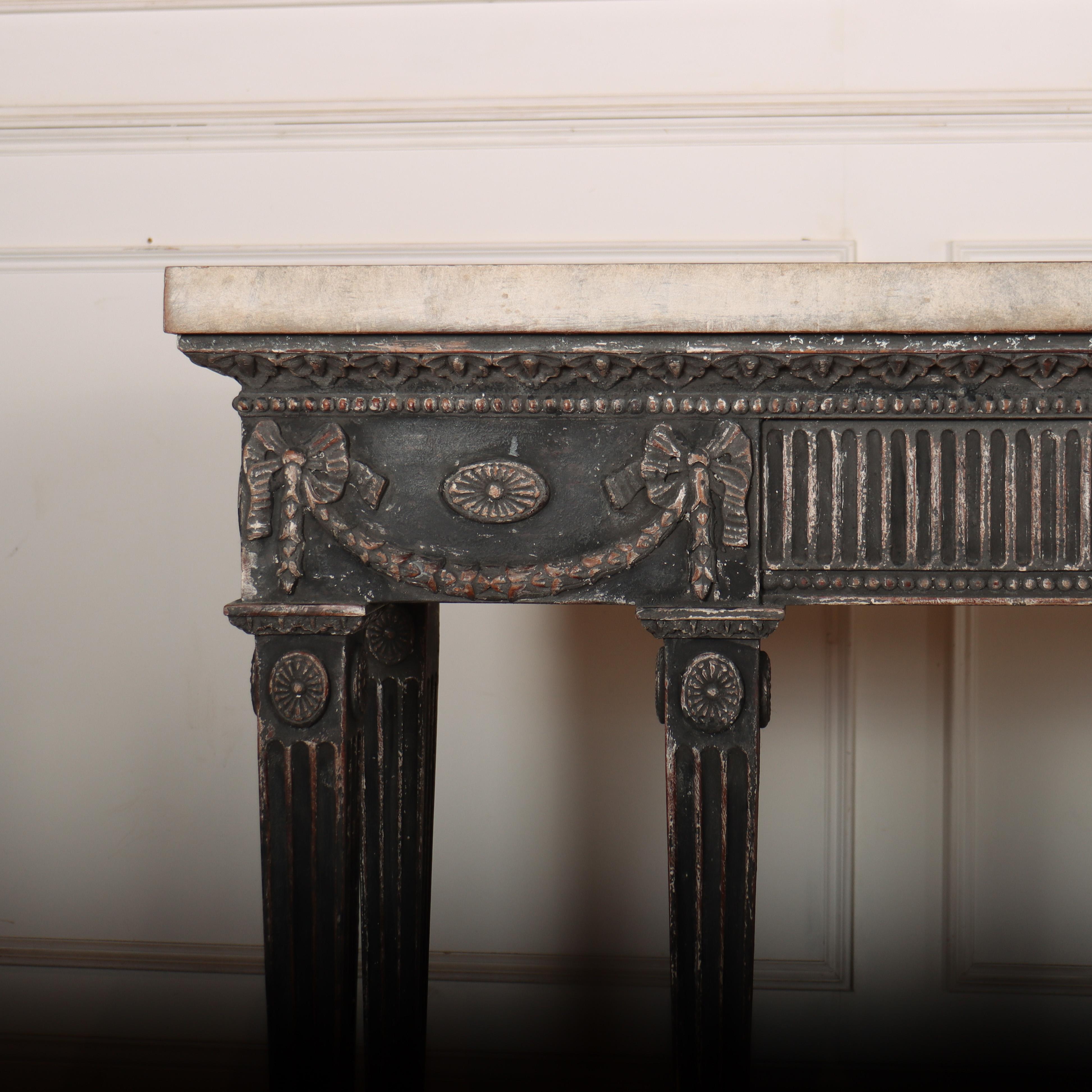 Stunning English 1920s copy of an 18th century console table. Good carved details to the frieze and legs, and a 4.5cm thick faux marble top. 1920.

Code: 8673

Dimensions:
W: 74.5
