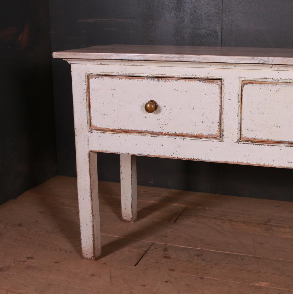 Custom made painted three-drawer dresser base with paneled back. 

This can be made to your chosen dimensions and paint colour. 

Dimensions:
76 inches (193 cms) wide
20.5 inches (52 cms) deep
32 inches (81 cms) high.