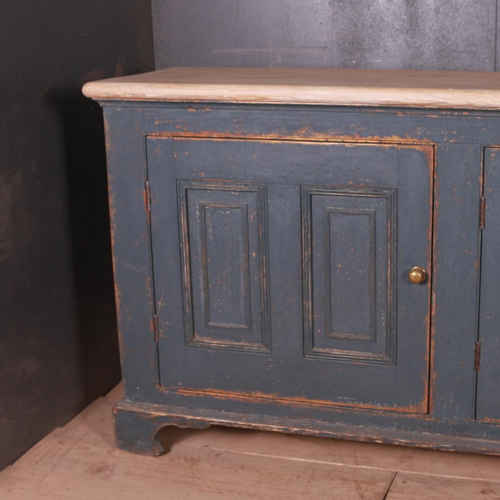 Large painted English dresser base, 1840.

Dimensions:
94 inches (239 cms) wide
18.5 inches (47 cms) deep
35 inches (89 cms) high.