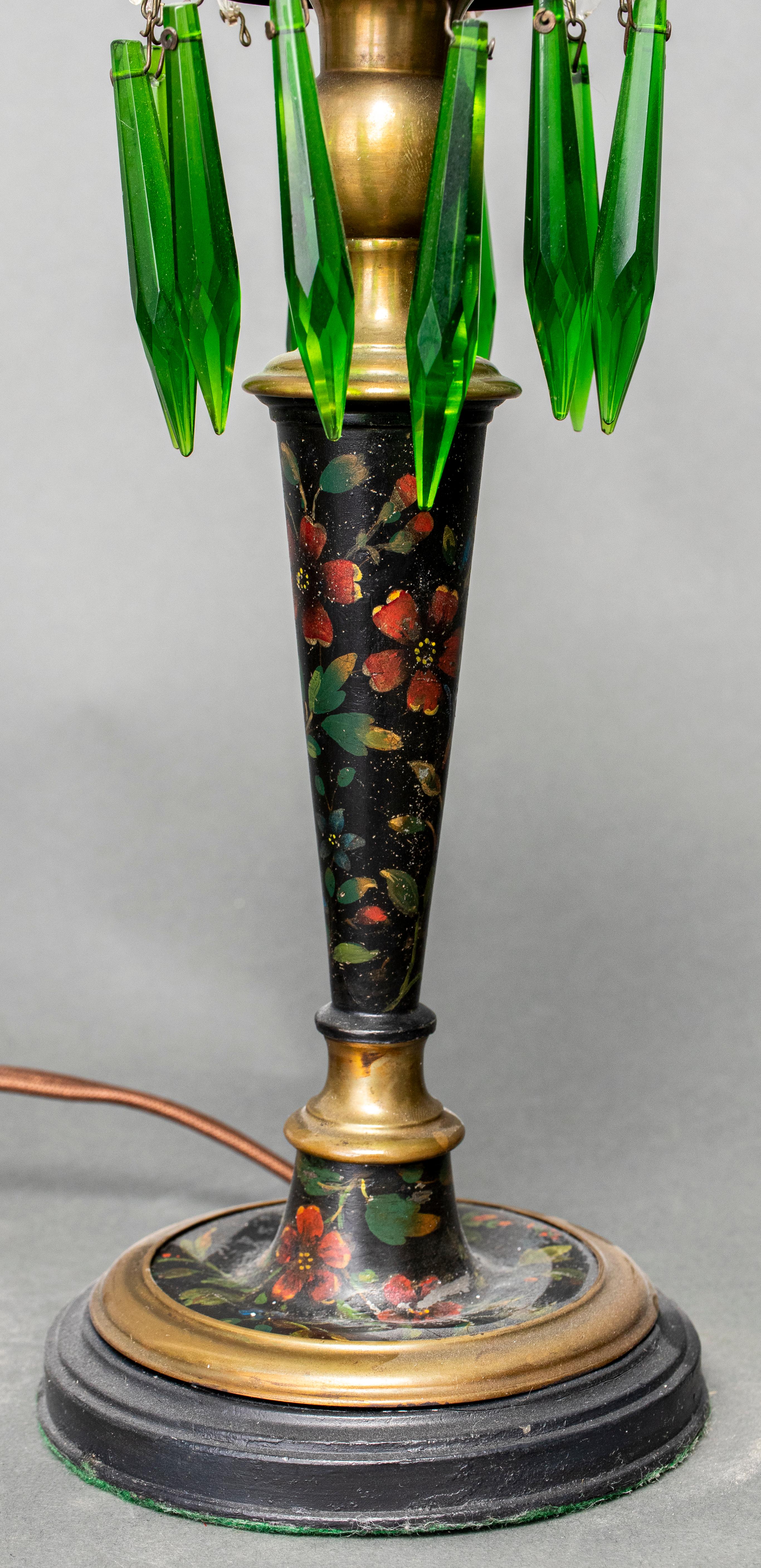 Pair of English green and clear glass luster candlesticks with floral paint decorated standards, mounted as table lamps. 14.5” height to socket x 4.5” diameter. Missing some pendants. Provenance: Removed from a 157 East 57th Street estate.