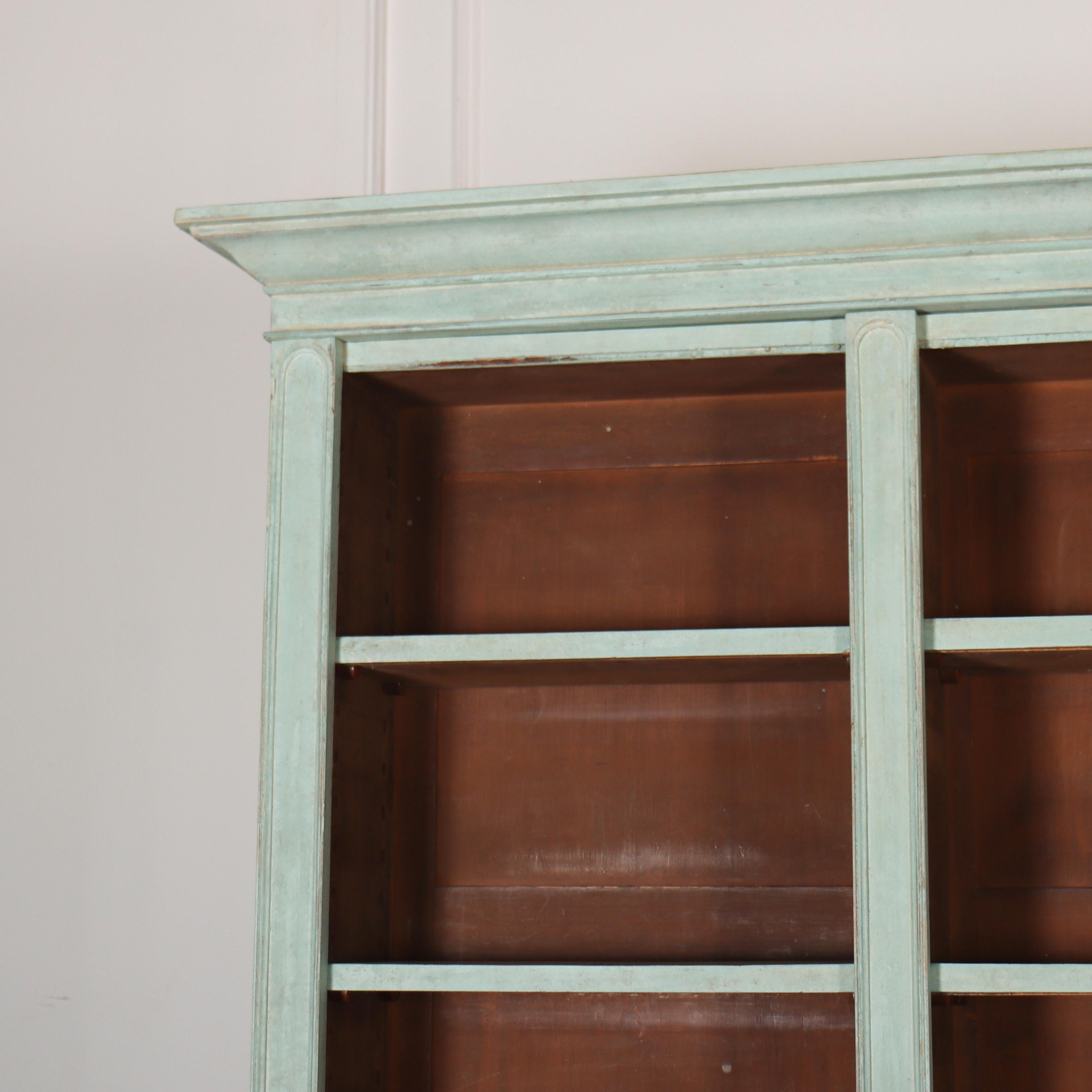 Very useful early 19th C English painted pine open bookcase with adjustable shelving. 1830.

Upper shelf depth is 8