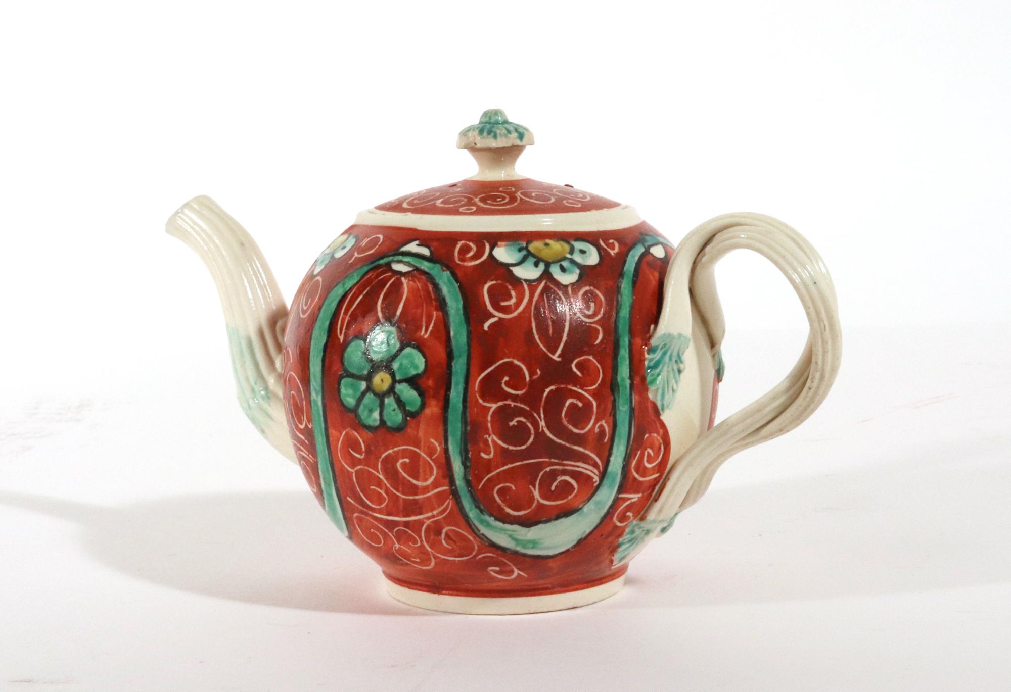 George III English Painted Orange-ground Creamware Teapot and Cover For Sale