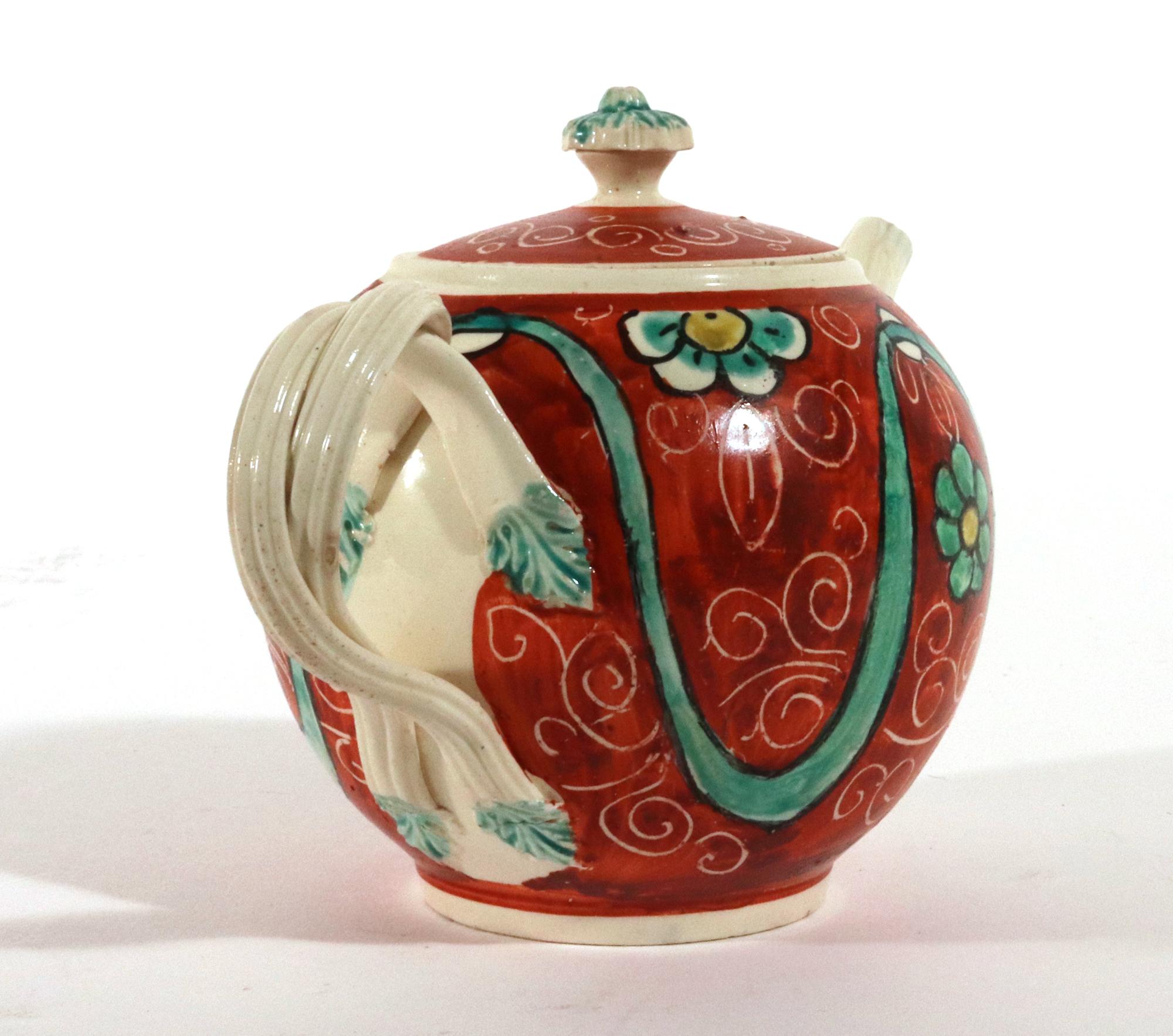 English Painted Orange-ground Creamware Teapot and Cover In Good Condition For Sale In Downingtown, PA