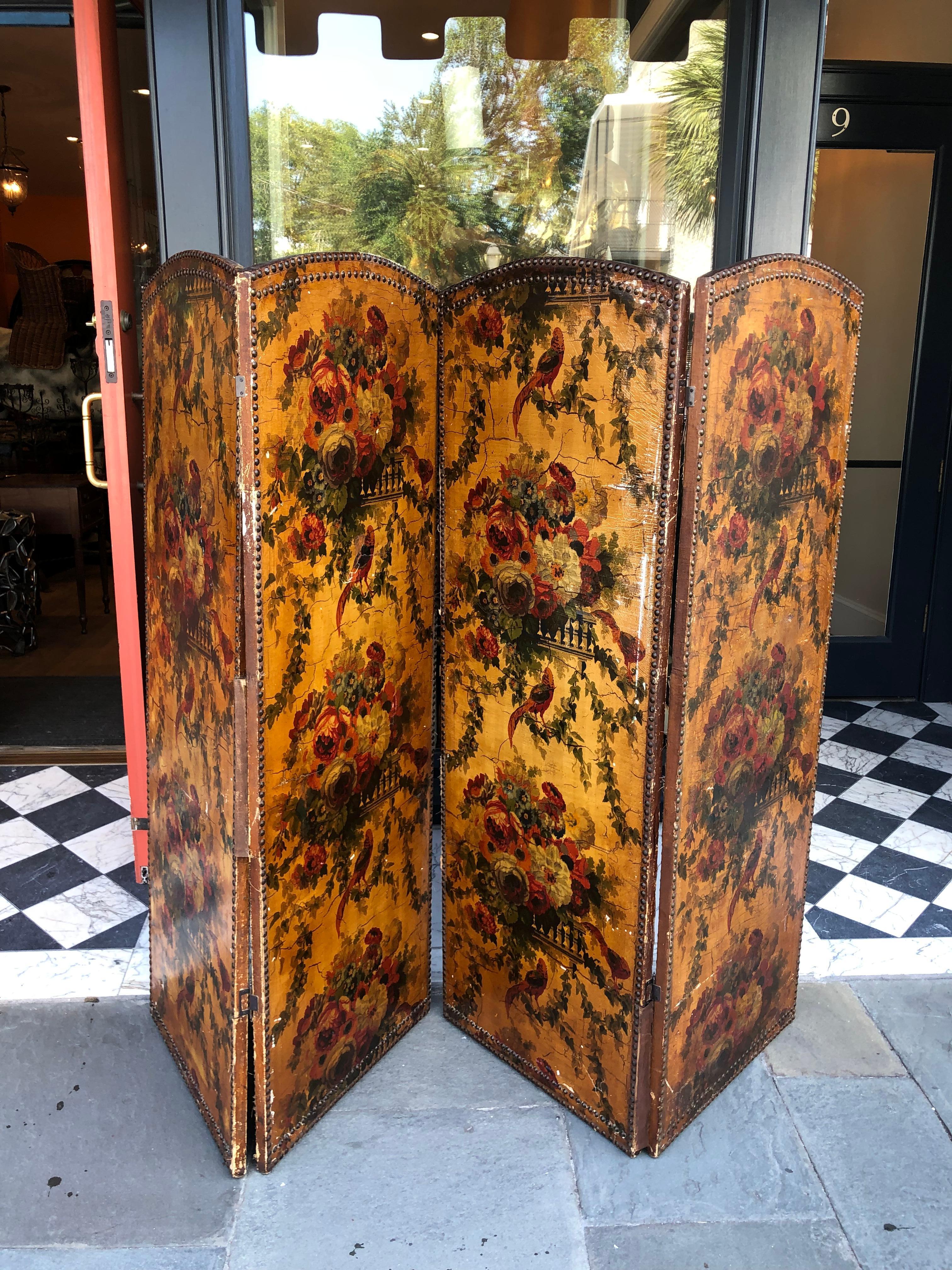 English painted leather screen. Small scale. Leather tacked onto interior frame. Bird and floral motif.