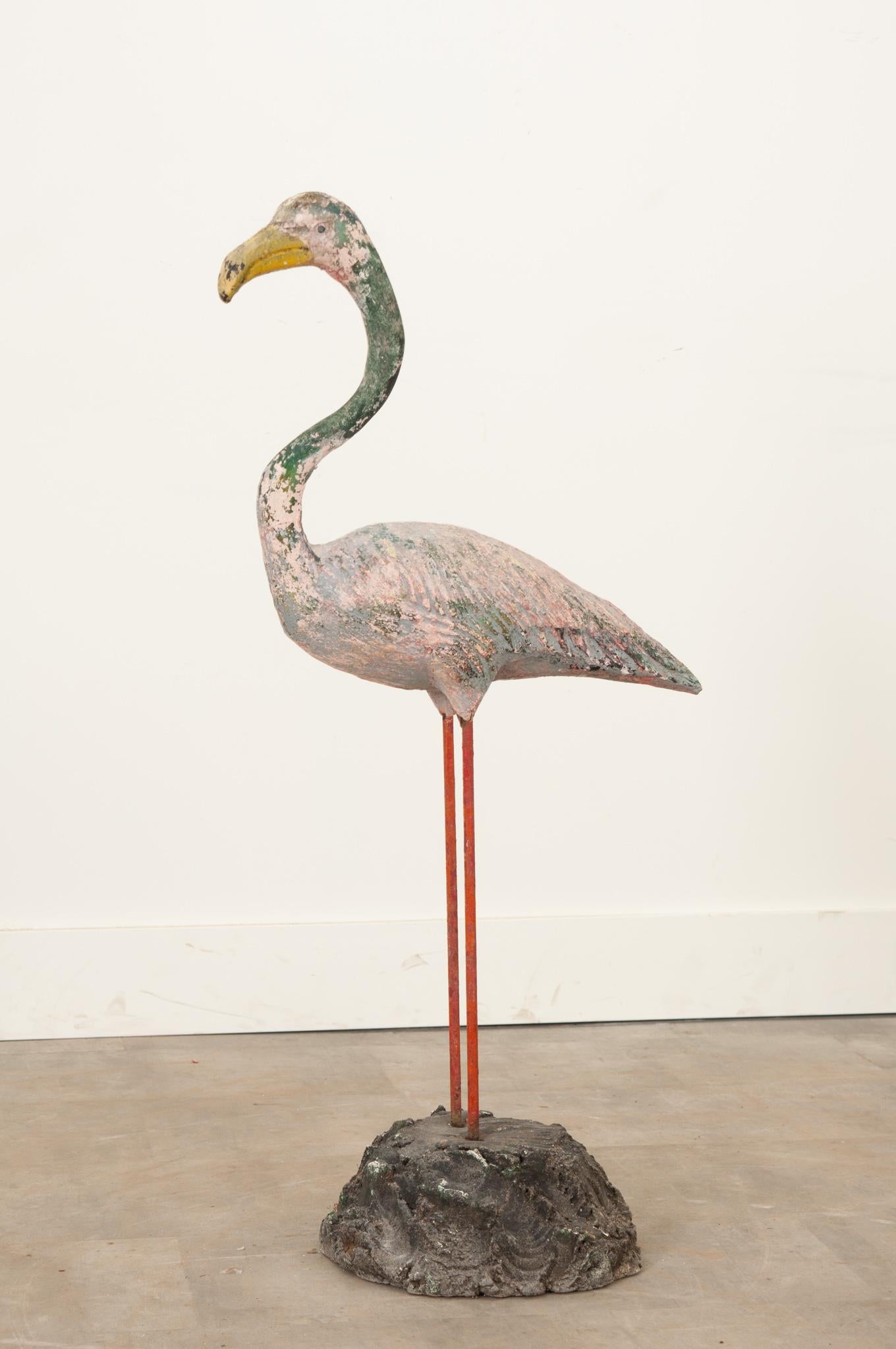 This playful stone and metal flamingo adds whimsy to any garden or interior. A perfect way to add color and fun to your designs is to add English garden statues such as this one. Its worn paint suits this flamingo well. Be sure to view the detailed