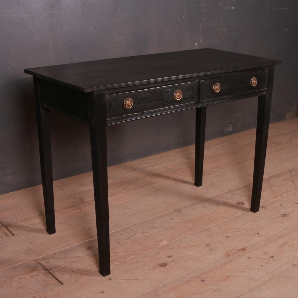 Early 19th C English painted two drawer desk/ lamp table. 1820.

Dimensions
39.5 inches (100 cms) wide
18.5 inches (47 cms) deep
28 inches (71 cms) high.
