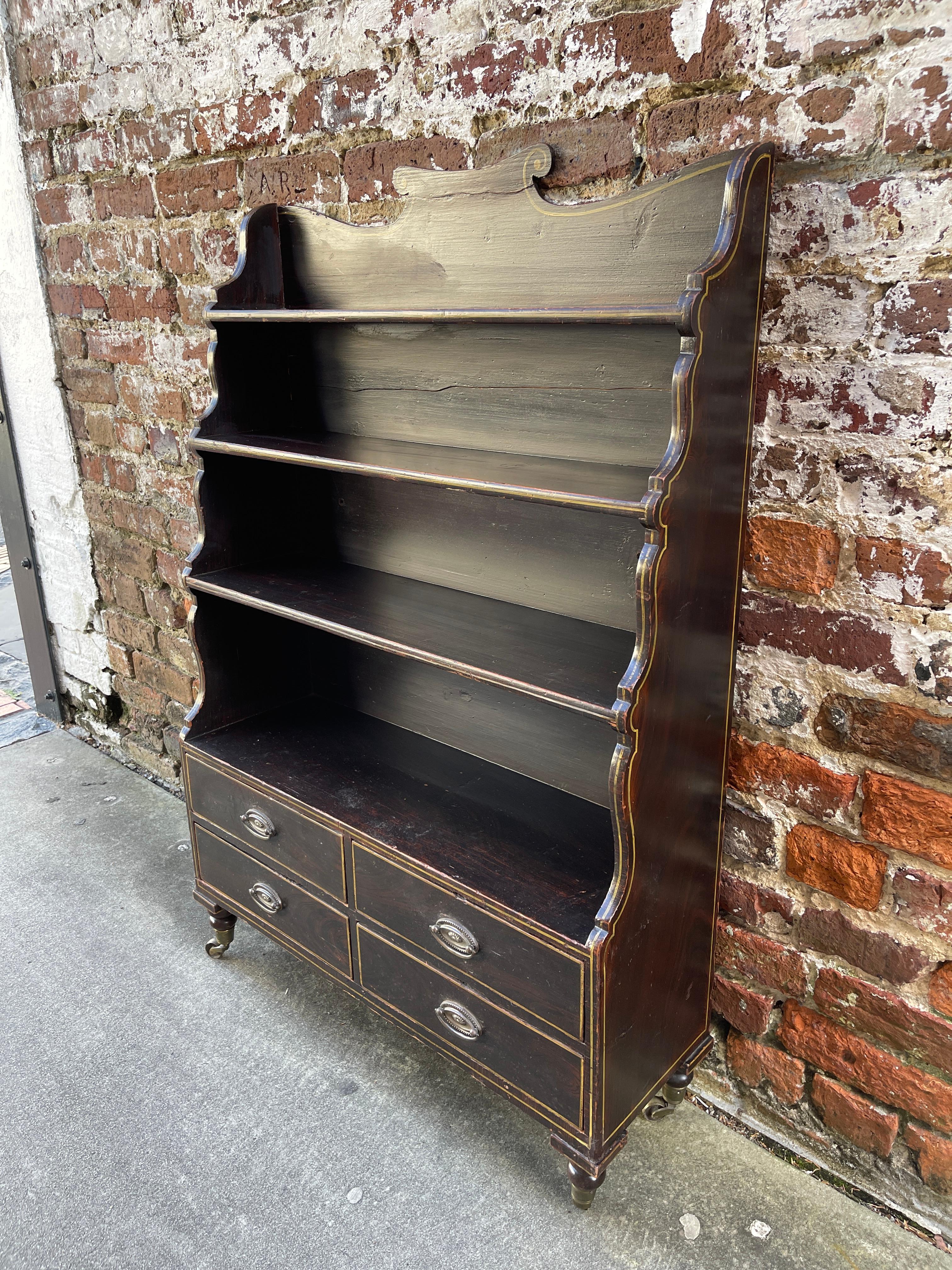 English Regency period faux painted bookcase. “Waterfall Form”. Painted to simulate rosewood.