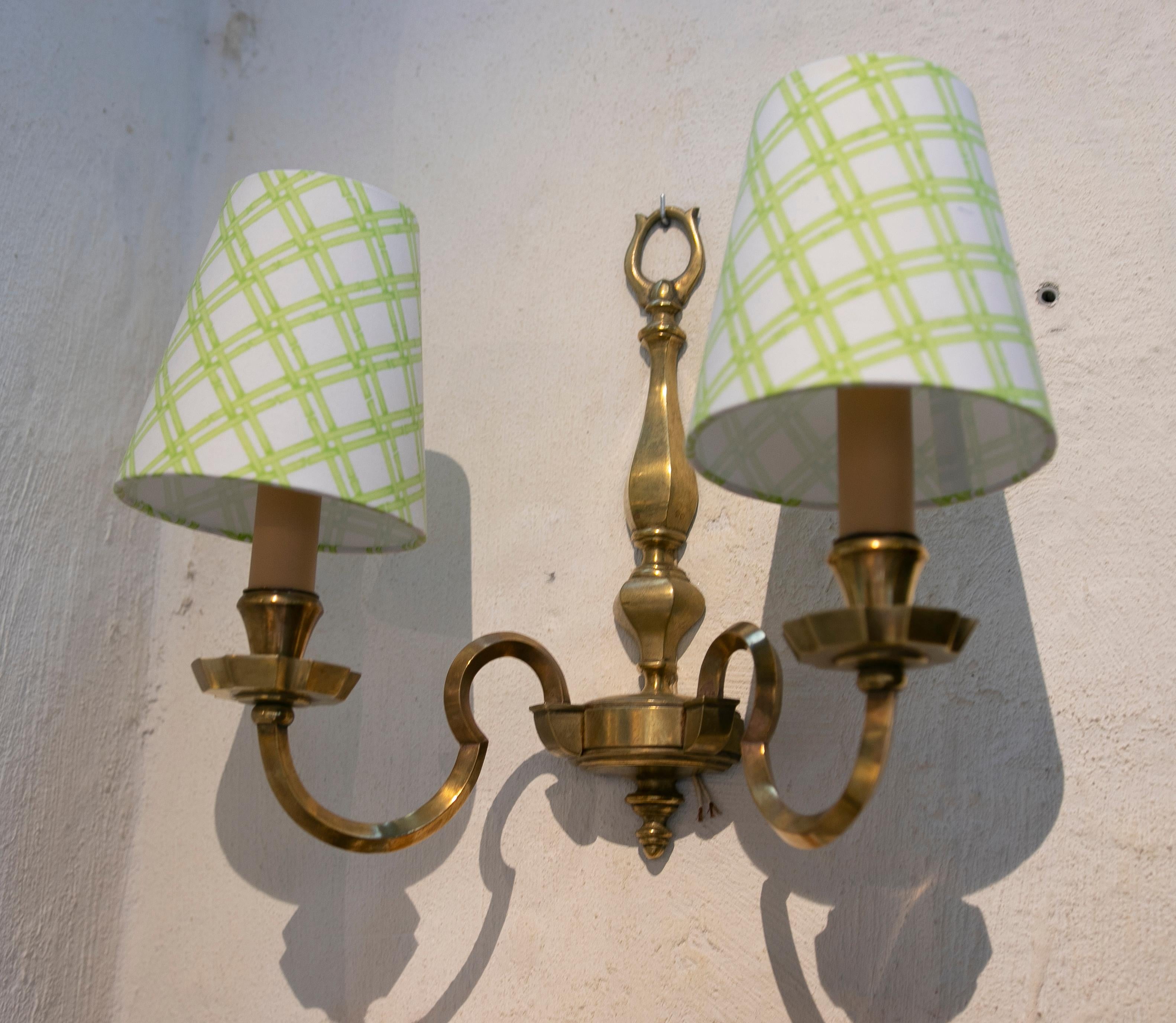 English pair of brass wall sconces
Price does not include the screens.