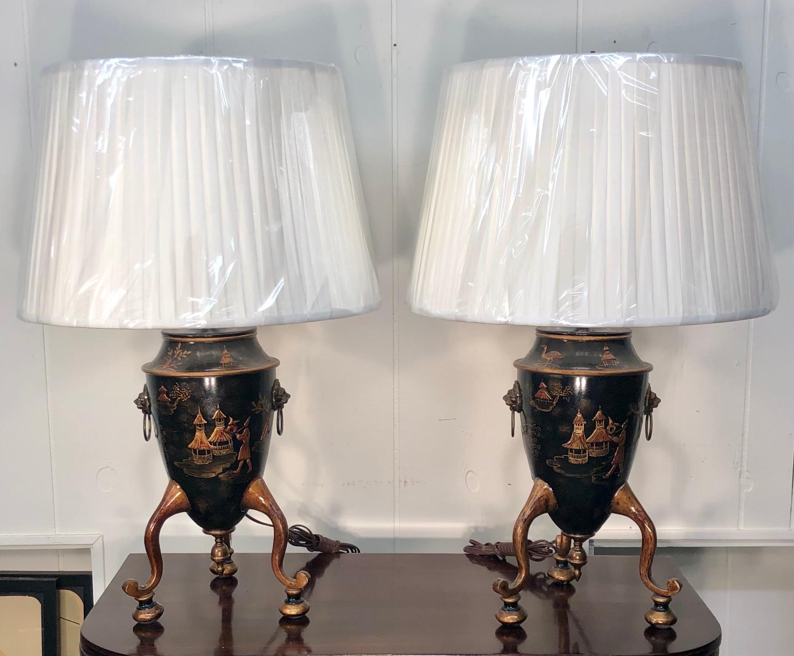 Elegant pair of Georgian style Chinoiserie tole urns, made into Lamps.
Shade is 20 inches Diameter.