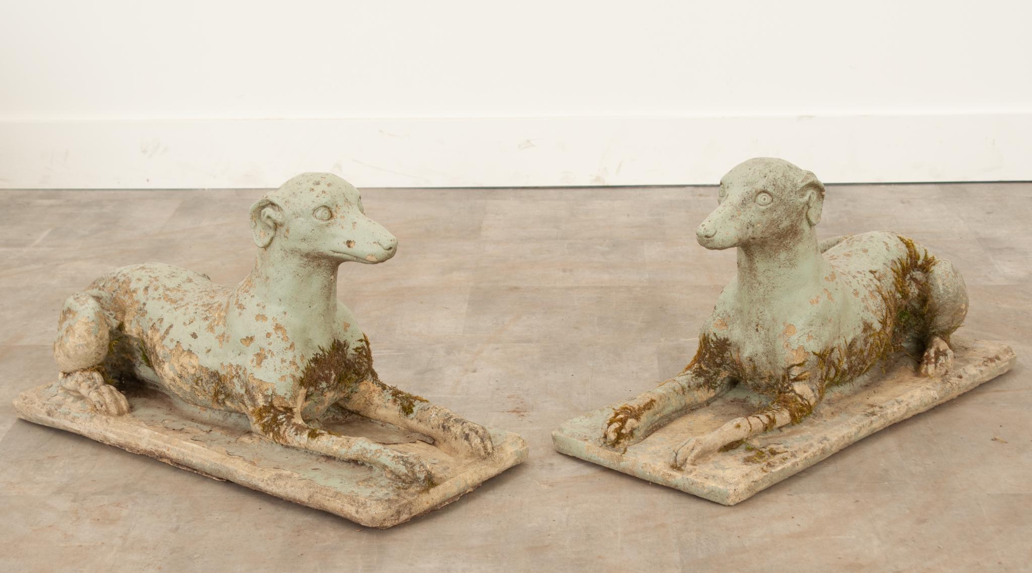 This charming pair of cast stone whippets are the perfect addition to any outdoor space. The light blue paint is wonderfully worn, giving them a great patina. Sold as a pair only. Make sure to view the detailed images for a closer look at these