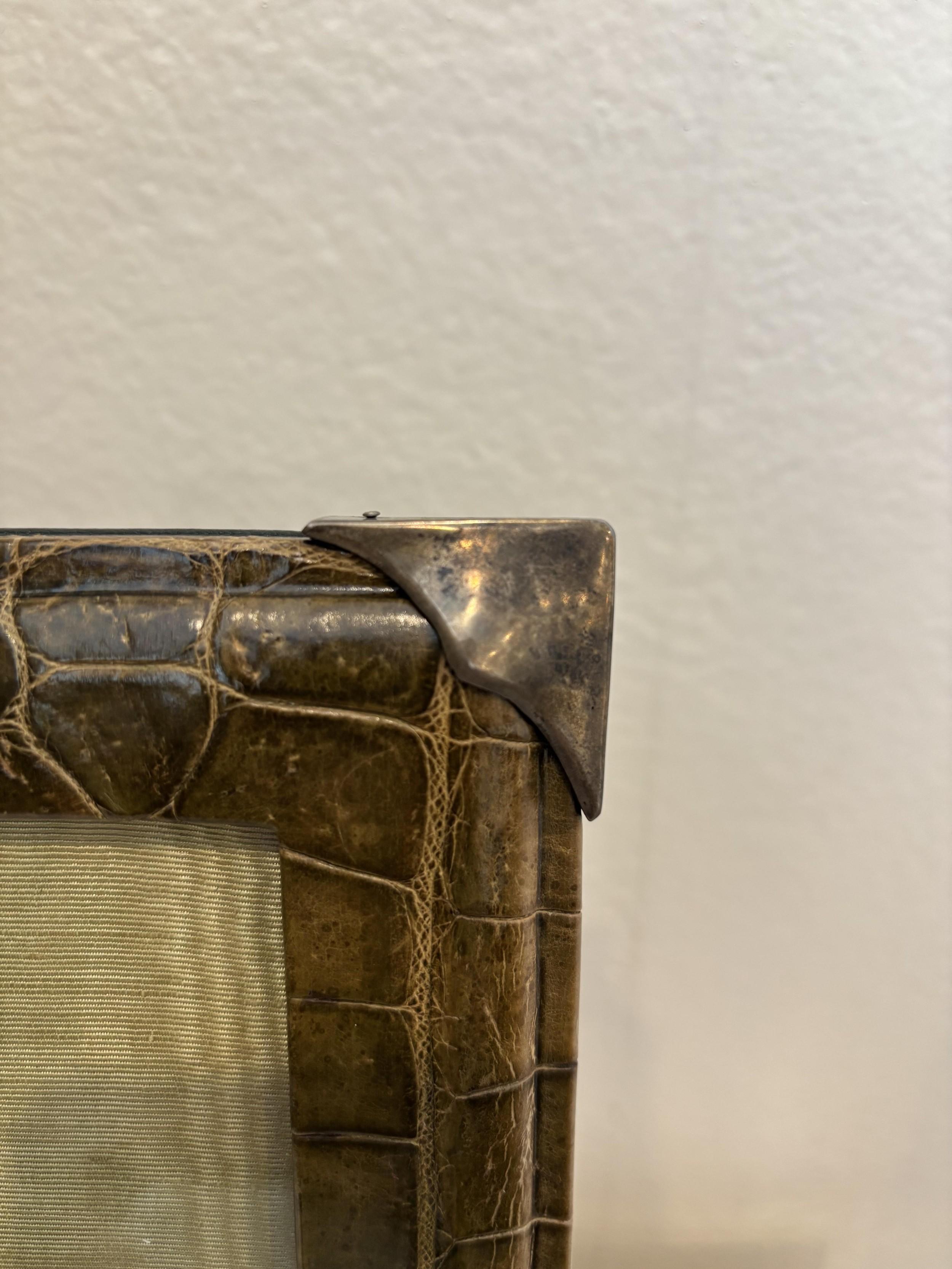 English Victorian style (20th Century) pale green crocodile easel picture frame with silver corners.