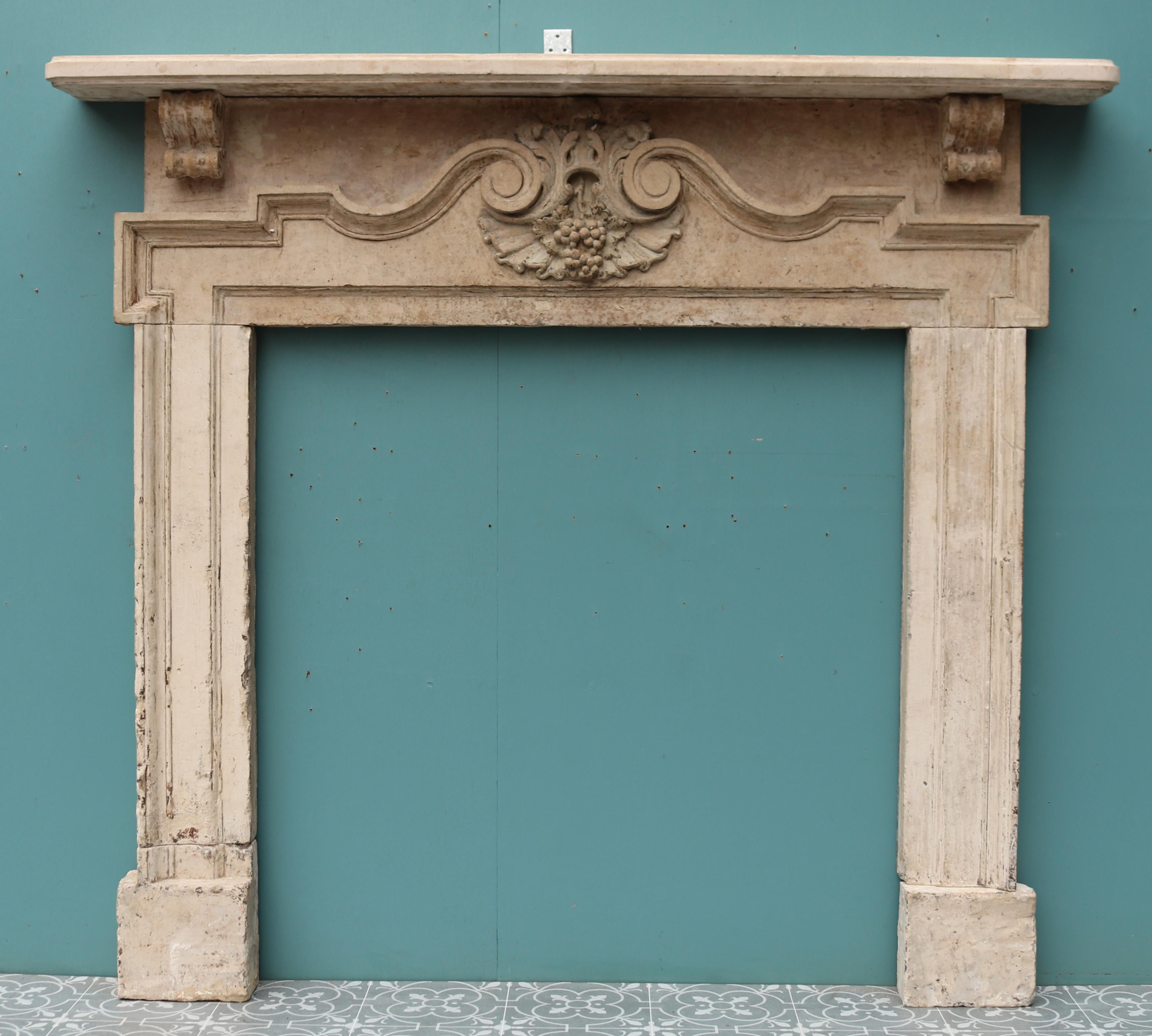 A mid-18th century Painswick Stone chimneypiece in the Palladian style.

Additional Dimensions:
Opening height 94.5 cm

Opening width 92 cm

Width between outside of the foot blocks 128.5 cm.