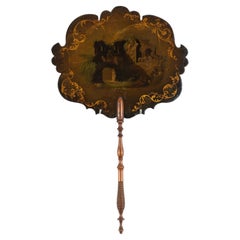 Pantalla inglesa de papel maché con mango de palisandro torneado, hacia 1835