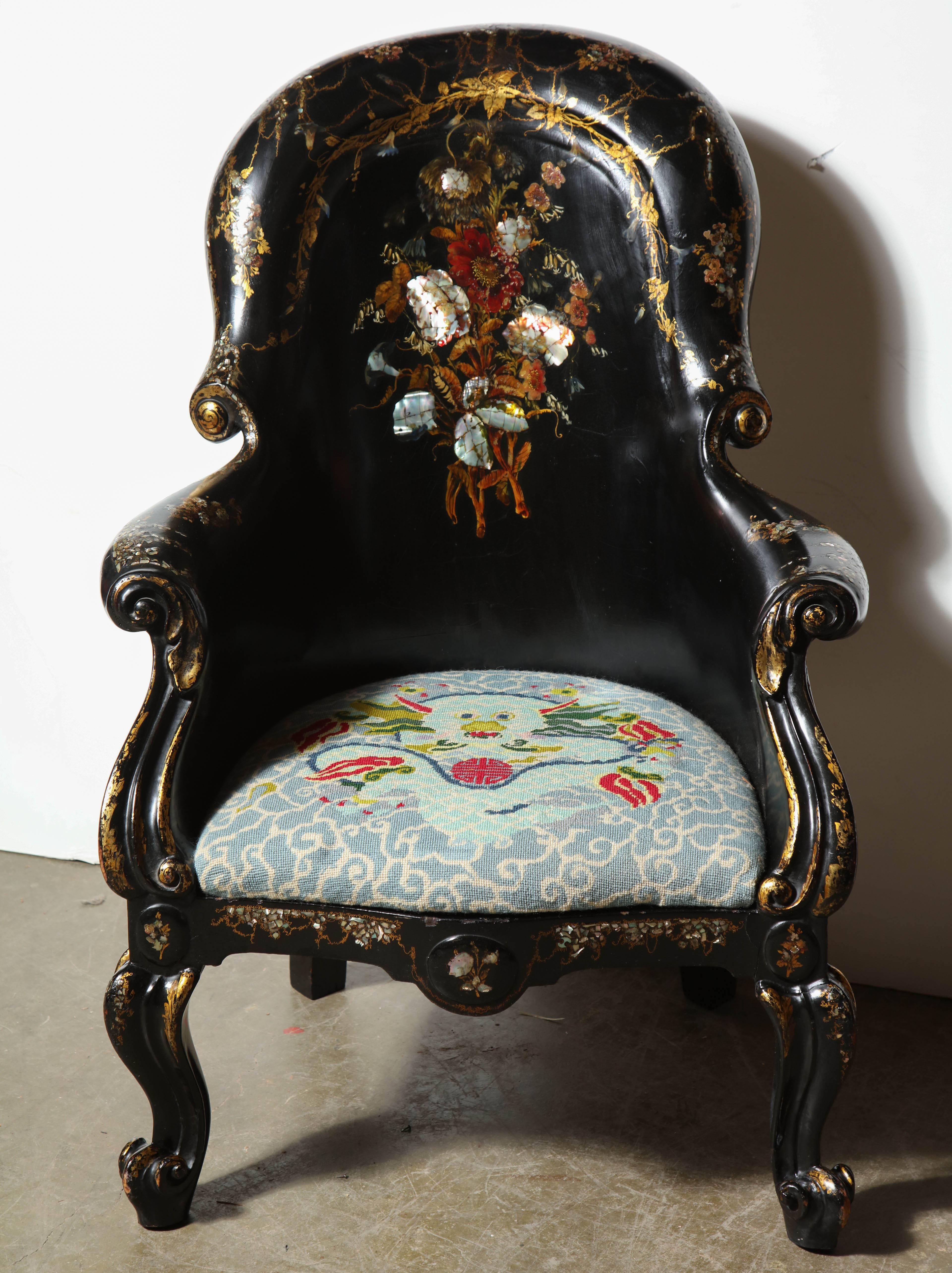 English black papier mâché gondola form armchair with mother-of-pearl inlay and cabriole legs.