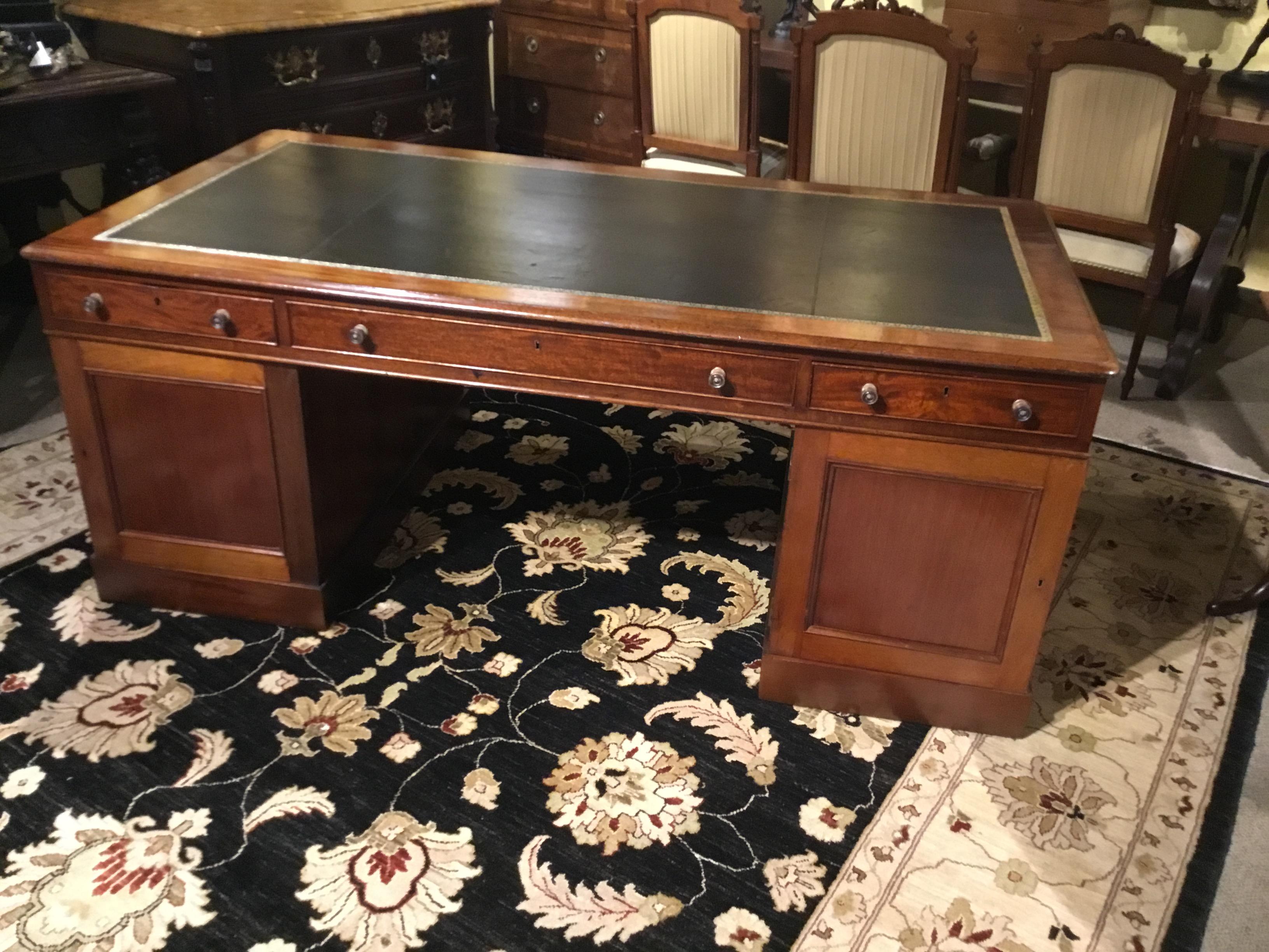 Handsome and functional desk that has drawers on one side and drawers and doors on
The opposite side. All drawers slide easily. Deep slide out trays pullout / pull-out easily behind 
The two doors. It has a beautiful old antique patina and