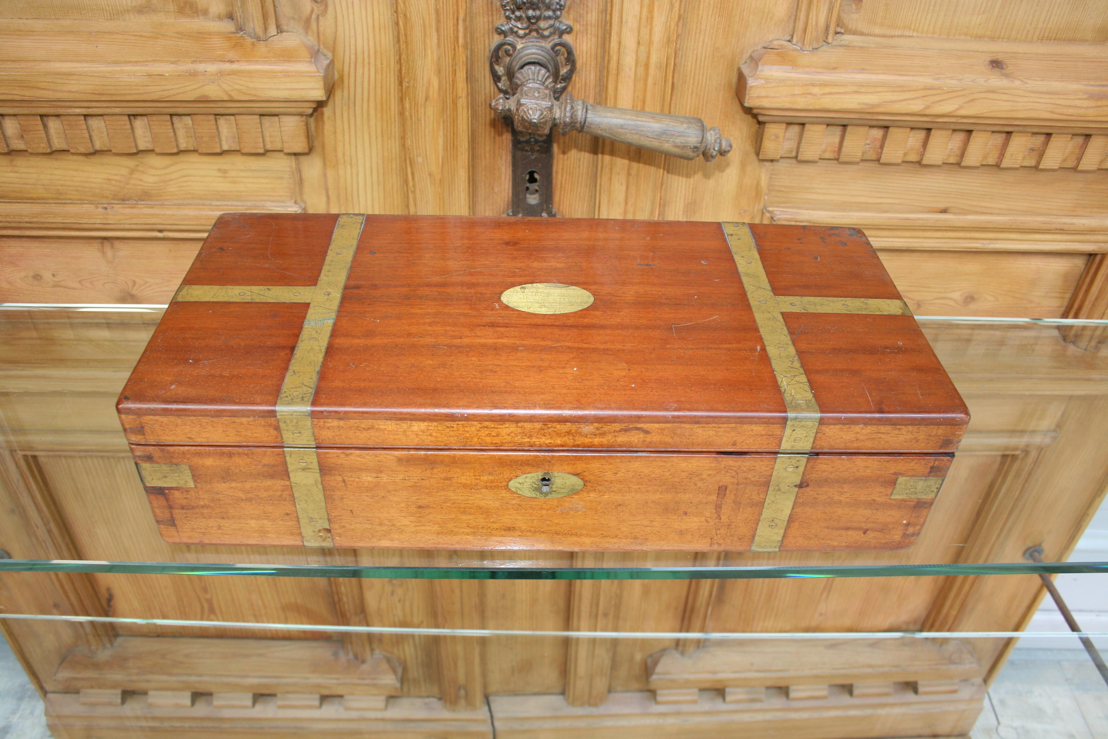 Curious antique English box made of mahogany with brass details, inside which are the working instruments of a pathologist. The division of the interior of the box is covered in red fabric and consists of several levels that can be taken out.