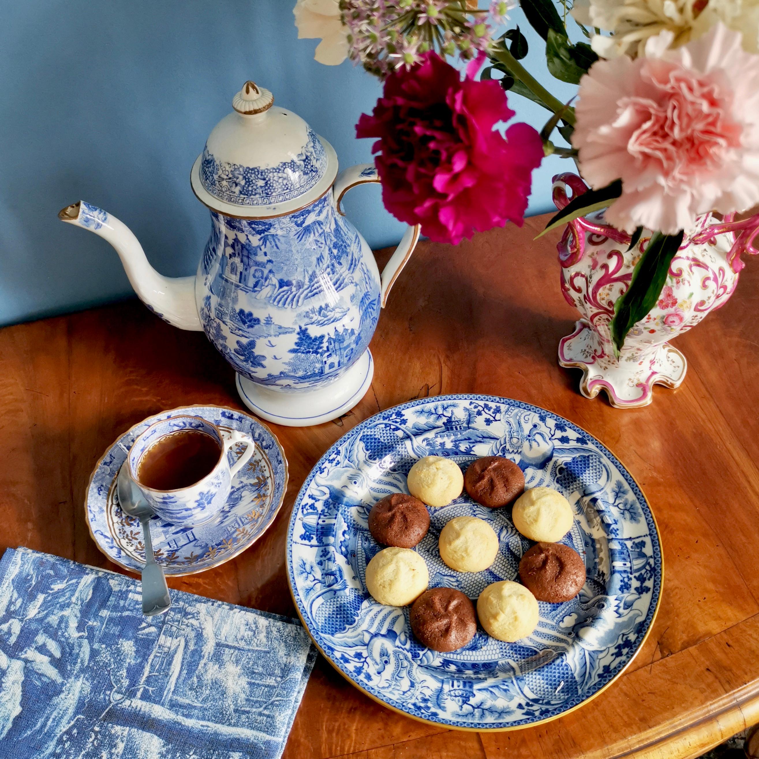 This is an exceptionally beautiful blue and white pearlware plate made in Staffordshire in about 1820. The plate has intriguing images of transfer printed dragons and snakes. 
 
Blue on white decorations were done in East Asia for many centuries,