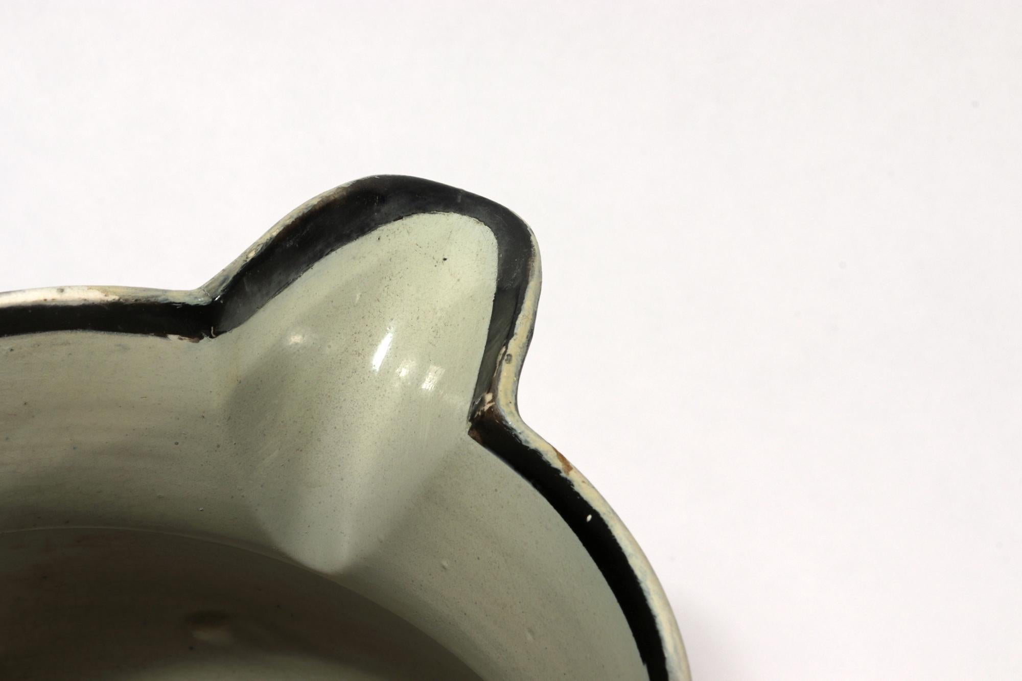 English Pearlware Pottery Silver Resist Lustre Jug with Bird Decoration,
Circa 1810-20

The silver-resist large Lustre (luster) jug is decorated with a silver resist ground with a bird amongst foliage below the spout and the name Foard (for the
