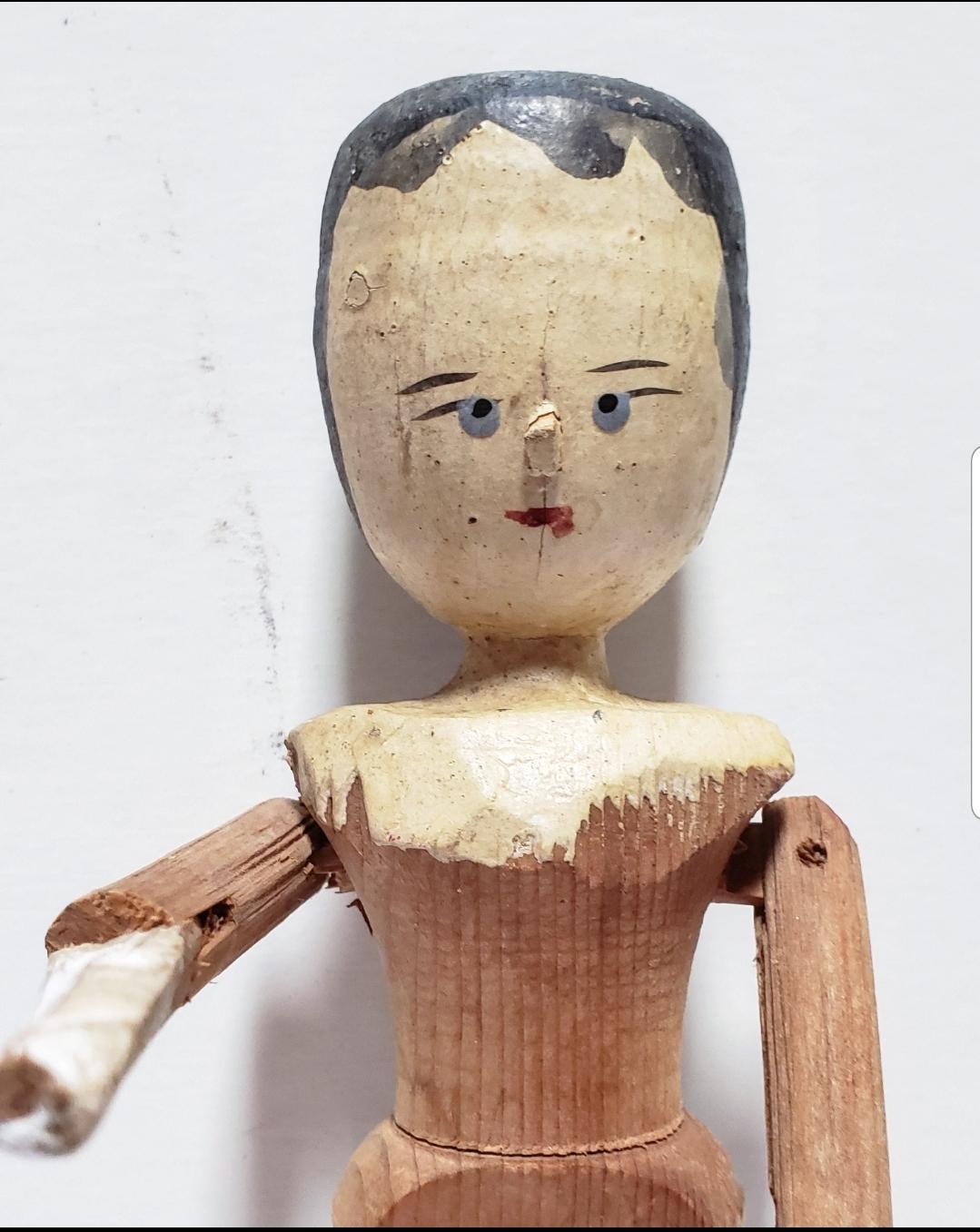 The English call these crudely hand-carved dolls Penny Dolls. These dolls were cheap toys sold on the streets of cities and villages in the British isles from the late 17th century. Quickly carved from deal (pine), these distinctive dolls with their
