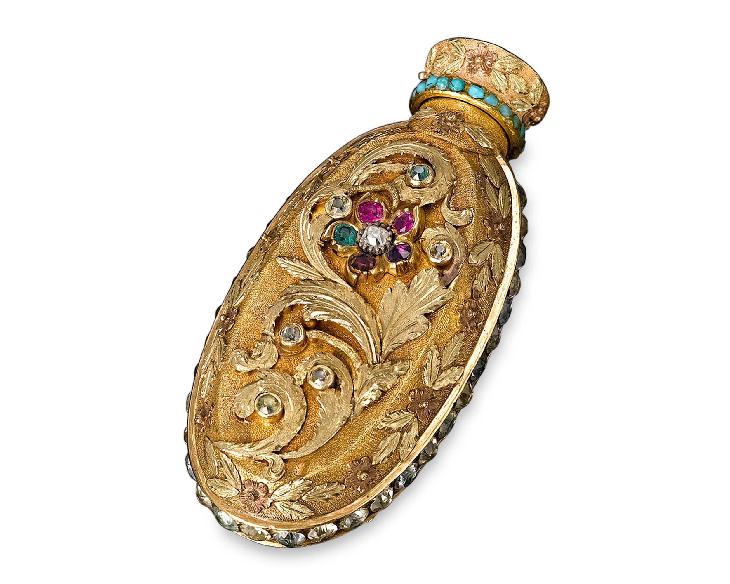 This rare and captivating English bottle contains a hidden treasure. Crafted of yellow gold and designed to hold perfume, snuff, or even smelling salts, this bottle is exquisitely decorated, from the bold applied acanthus leaves to the sparkling