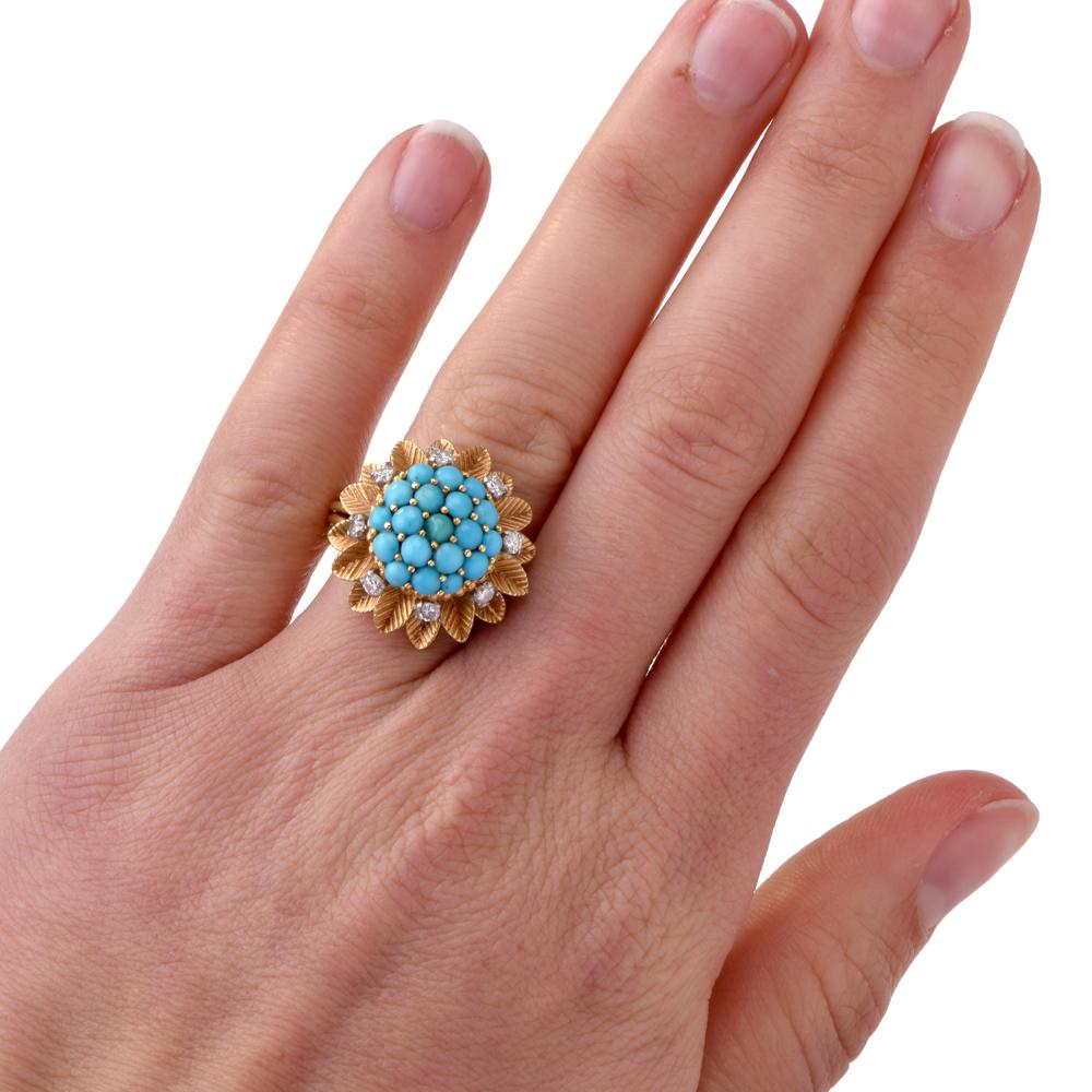 This exquisite English made Vintage Diamond & Turquoise cocktail ring is crafted in solid 18K Yellow Gold. Displaying a detailed floral motif, it is adorned with a cluster of 19 genuine round cut Turquoise Cabusion approx 2.5mm each The turquoise