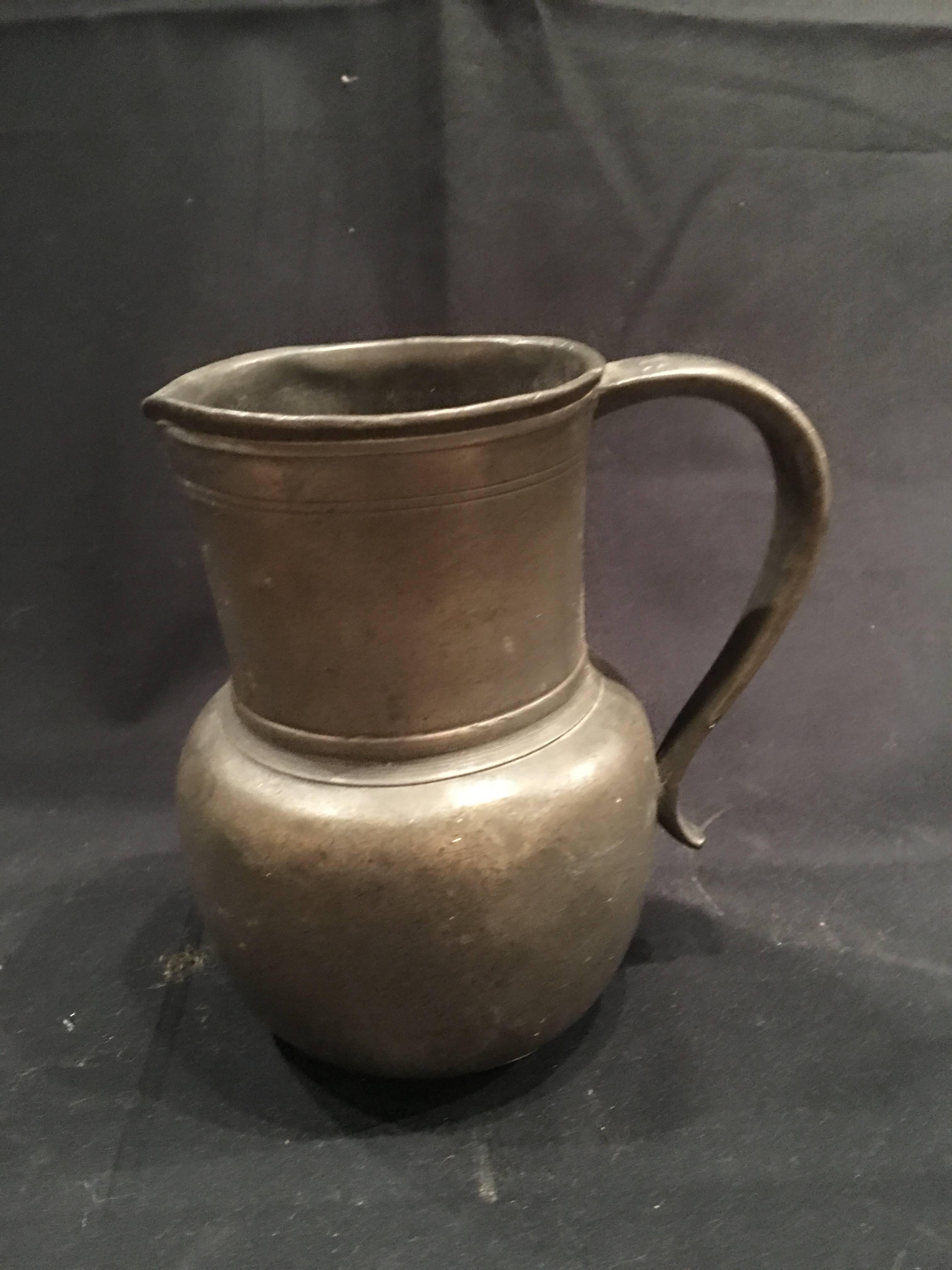 English Pewter jug or pitcher with a handle, 19th century.