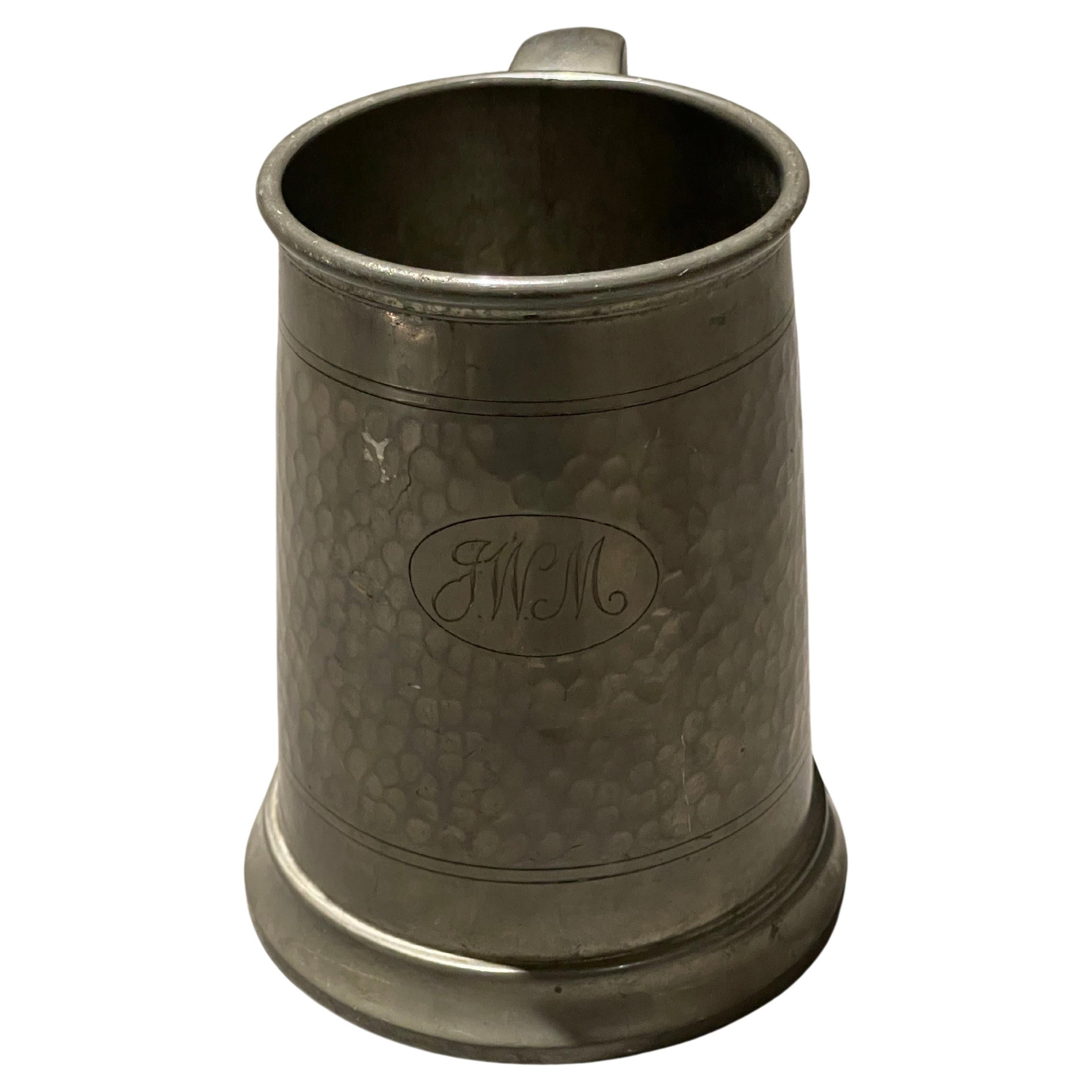18th-century English pewter mug or cup with handle. Measures: 5.5