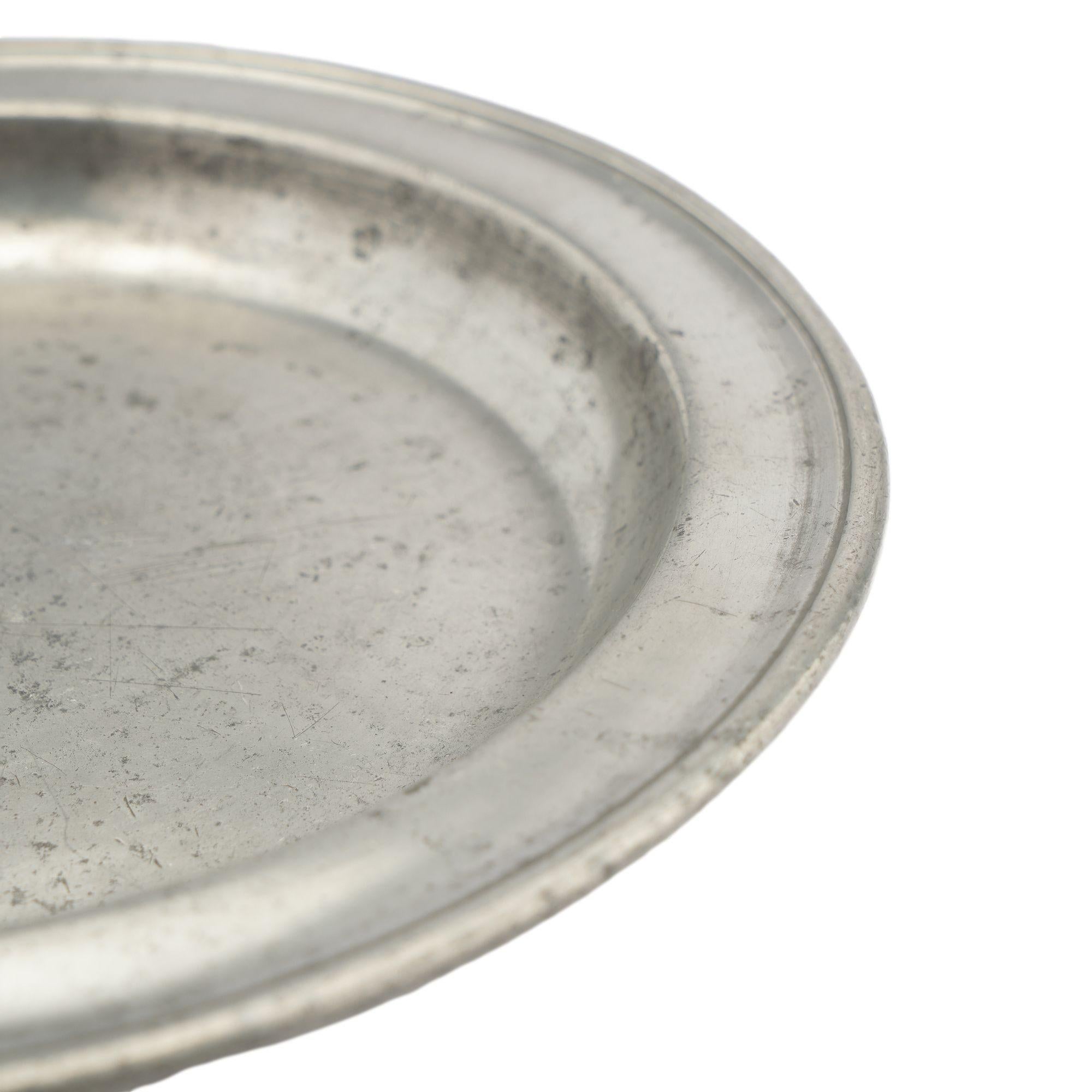 Pewter English pewter plate with beaded rim and touch mark on the reverse, 1700's