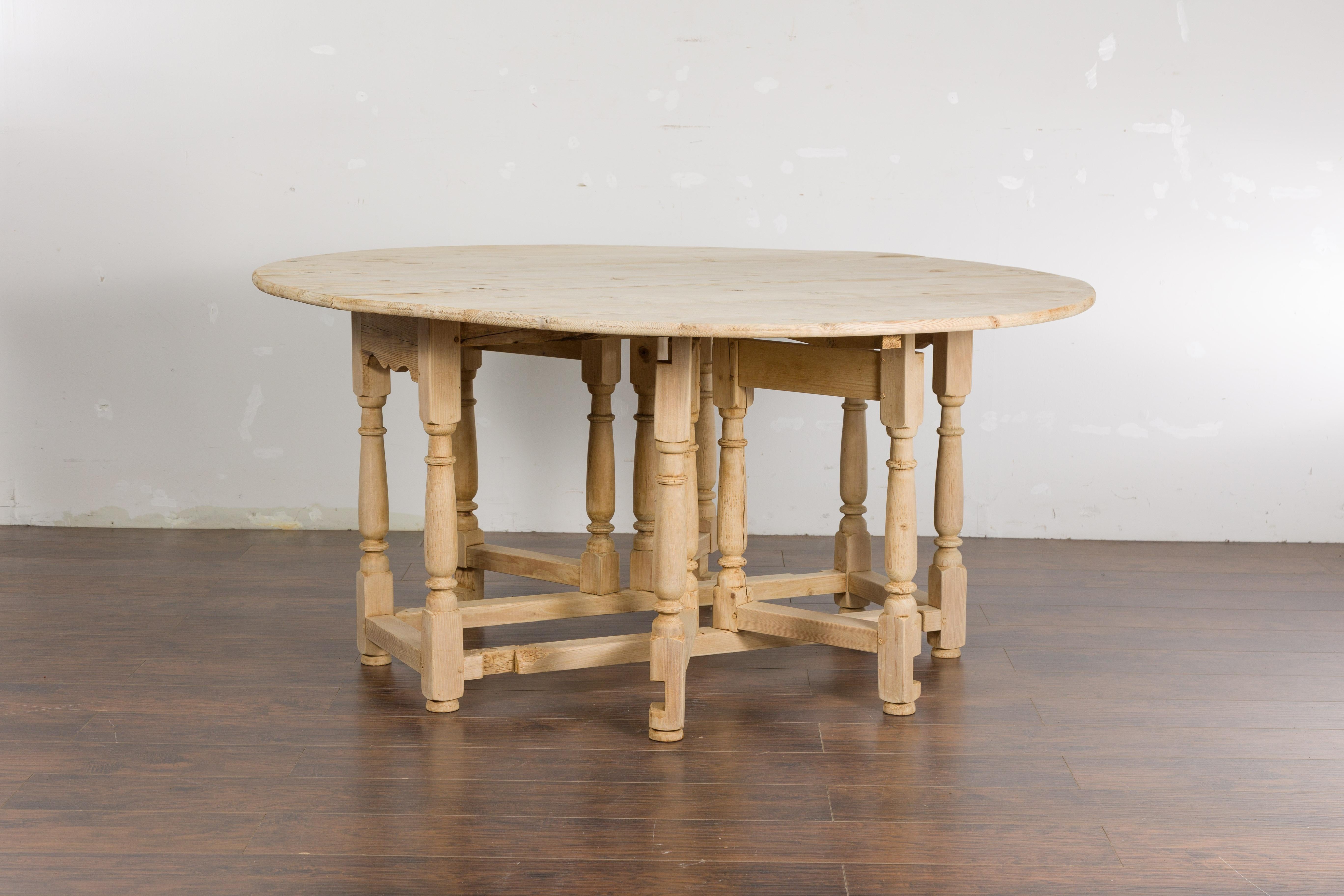 English Pine 19th Century Drop Leaf Table with Oval Top and Carved Apron For Sale 9