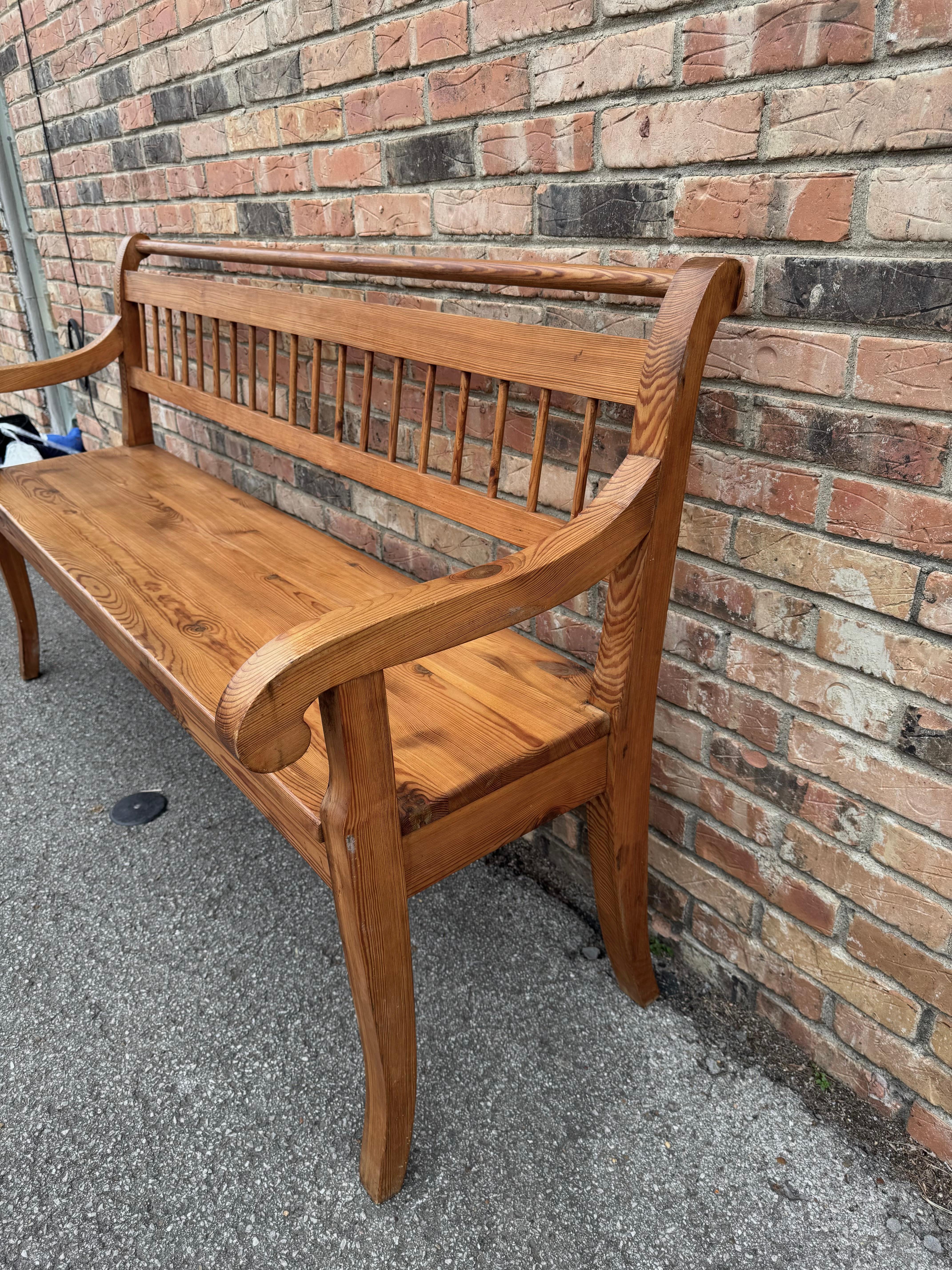Lovely English pine hall bench seat, moulded top rail above shaped vertical spindles across the back, shaped scroll arms

Dimensions
63ʺW × 22ʺD × 36ʺH