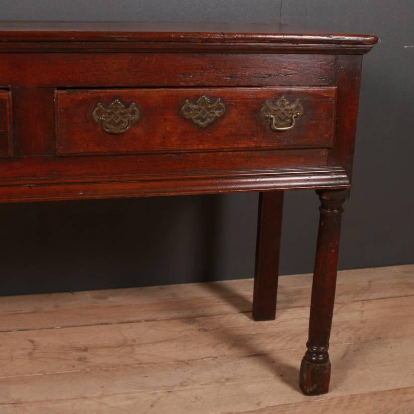 Good 18th century English patinated pine dresser base with baluster legs, 1770

Dimensions:
66 inches (168 cms) wide
17.5 inches (44 cms) deep
31 inches (79 cms) high.

 