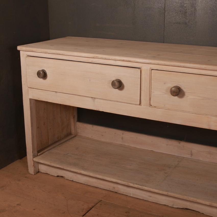 Large 19th century English bleached pine 3 drawer potboard dresser base, 1820.

Dimensions
114 inches (290 cms) wide
24 inches (61 cms) deep
36 inches (91 cms) high.

 