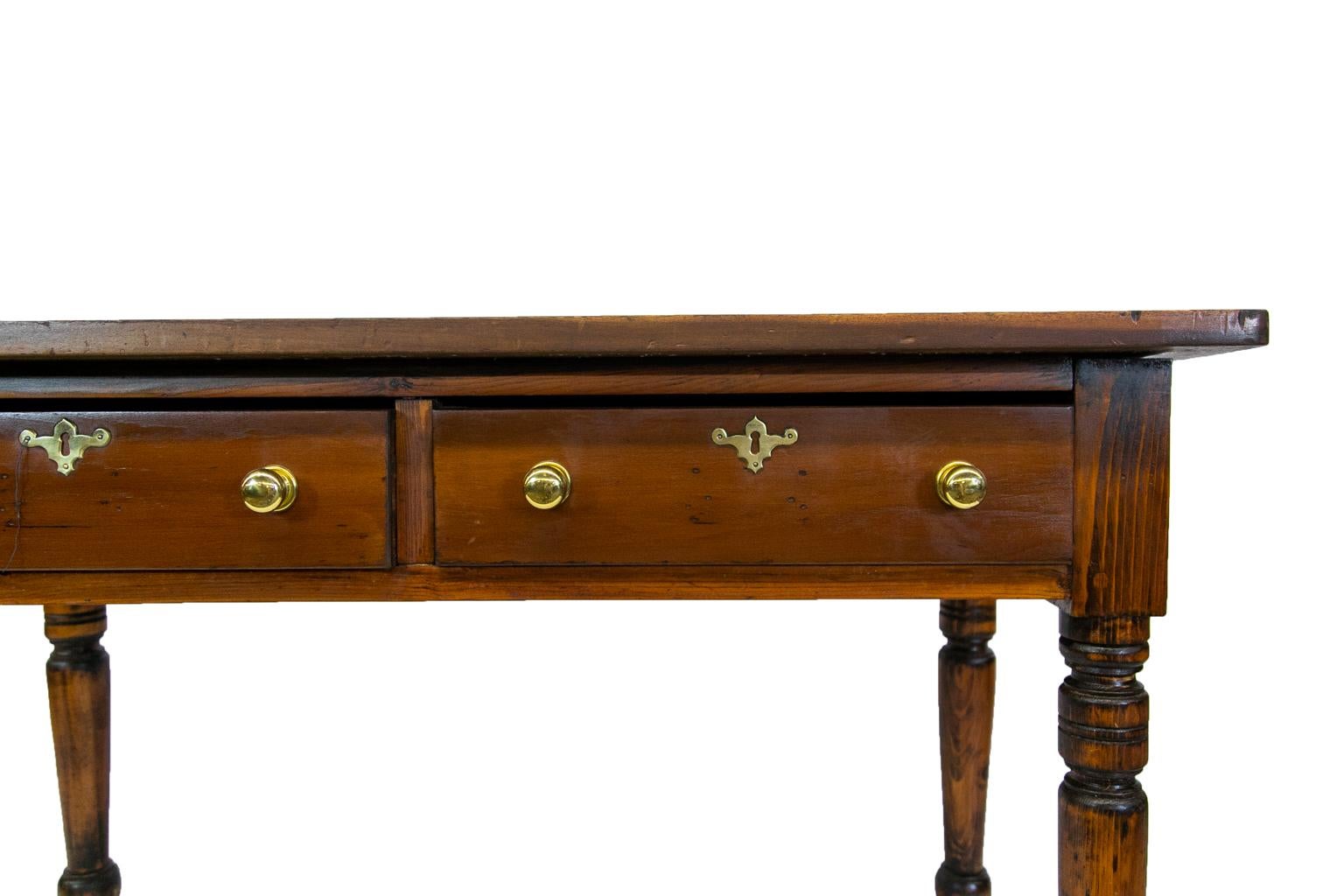 English pine drop-leaf table, with the legs having exposed peg construction. The top has a single drop leaf in the rear.
      