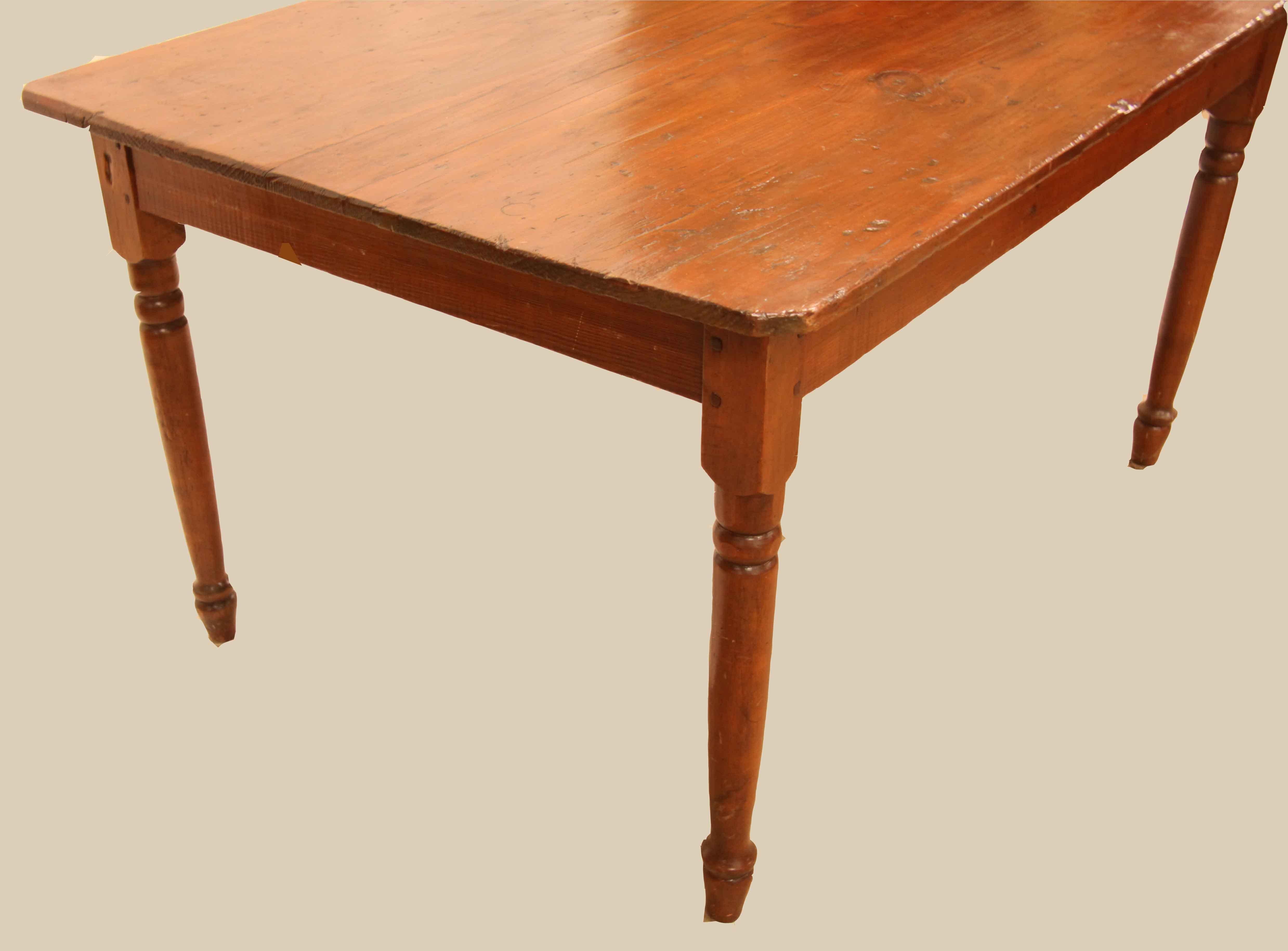 English pine farm table,  the top has nice rustic character, color and patina ,  the legs are are turned and taper gently and are secured with double peg construction.  This table will seat six comfortably and there is ample leg room .   