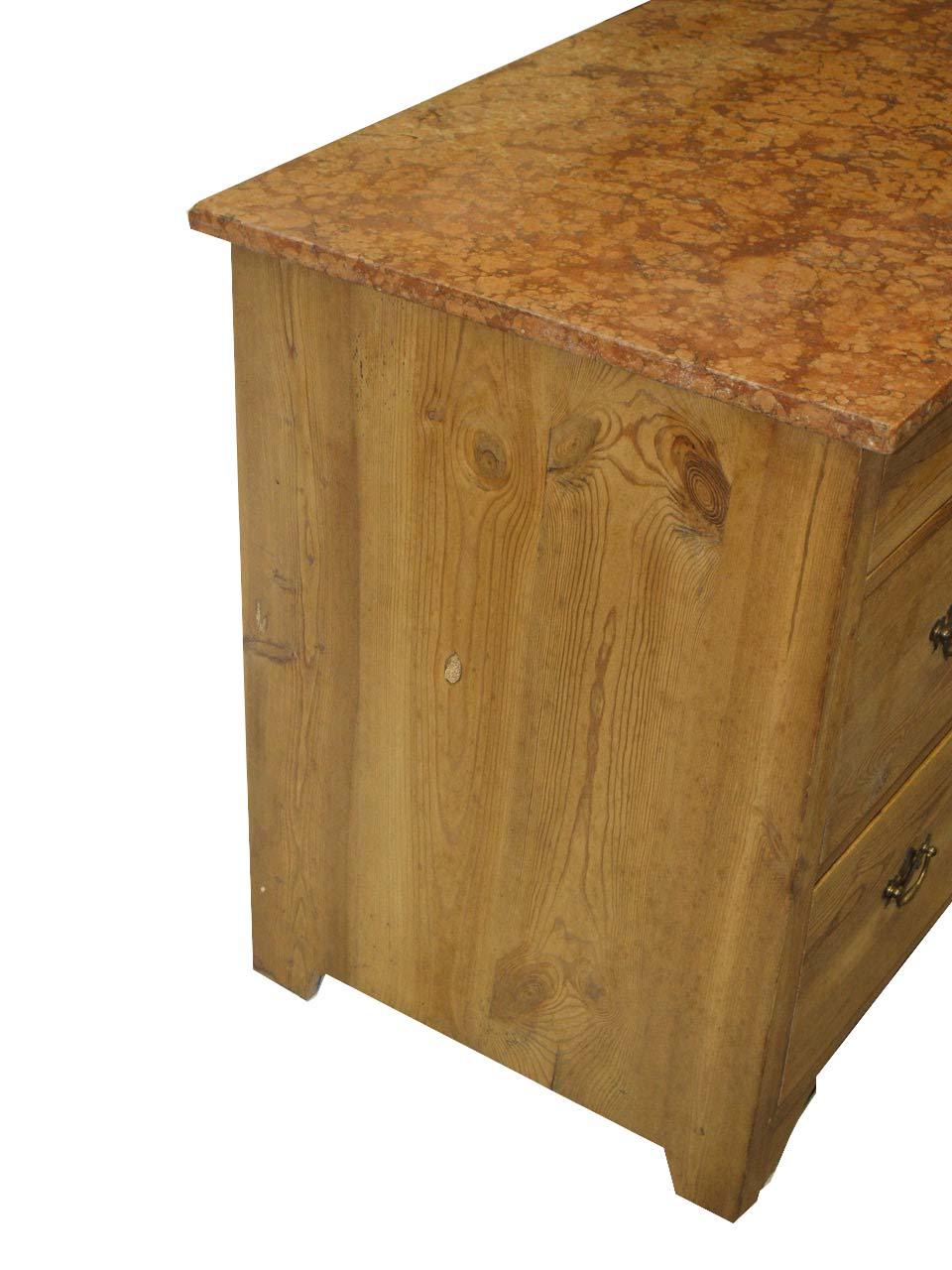 English pine marble top chest, the sienna top with beautiful figuring , the two over two drawers with ''bat wing'' brass pulls and oval escutcheons. This small size makes it a versatile fit for most any room in the home.