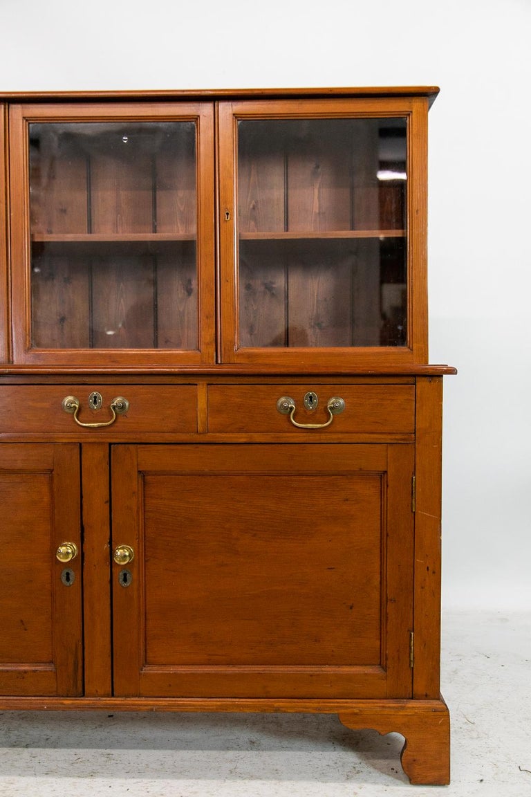 The upper half of this stepback cabinet has two doors and center panel that slides to the right for access when the right door is open. All have the original wavy glass panes and tongue and grooved backboards.